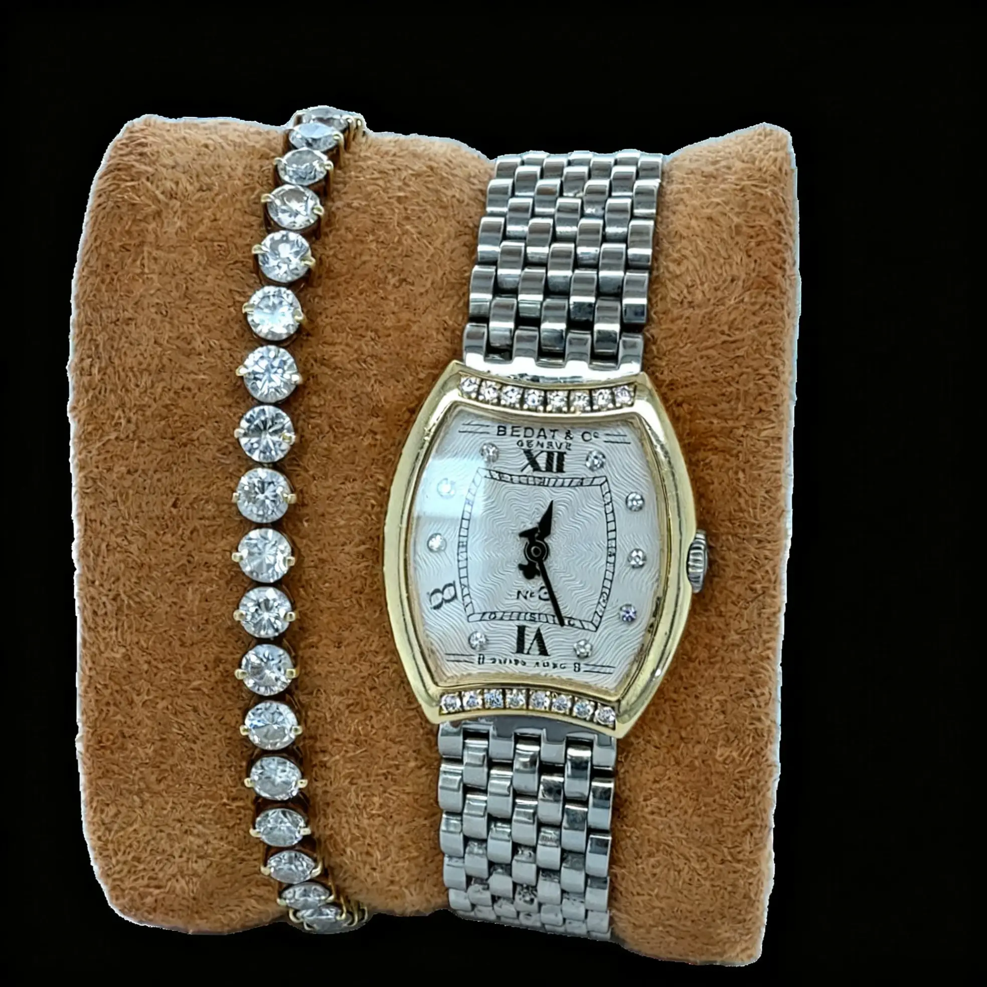 My Bedat watch and a bracelet placed side by side on the removable cushion, with space between them.