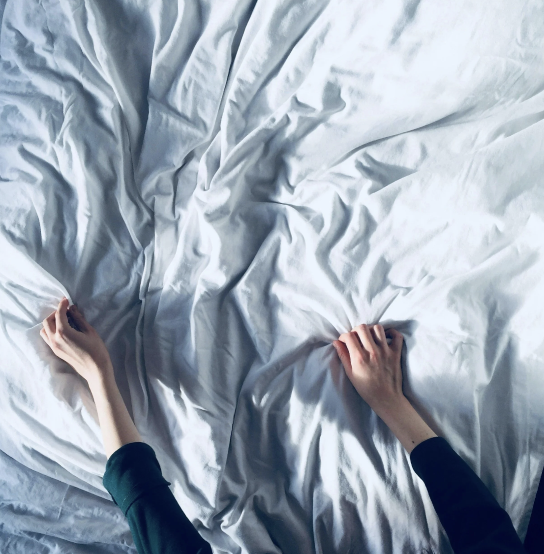 woman making bed as form of exercise mindset study