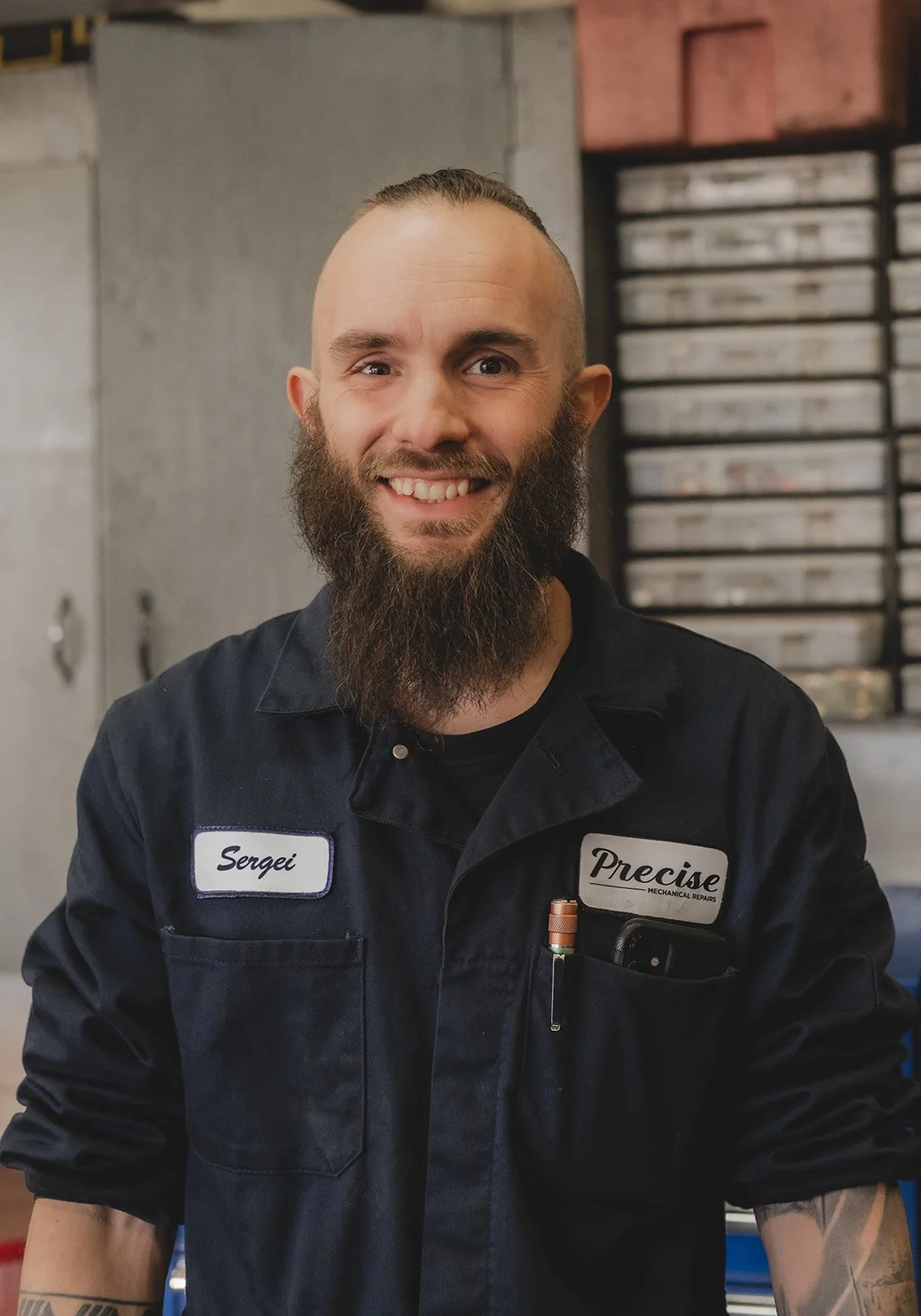 Man with beard and coveralls