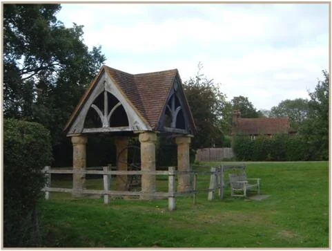 AND LASTLY ....The village pump, with its stone pillars, carved wooden gables and tiled roof, is a typical Surrey pump, though now only ornamental. It is Grade II listed.