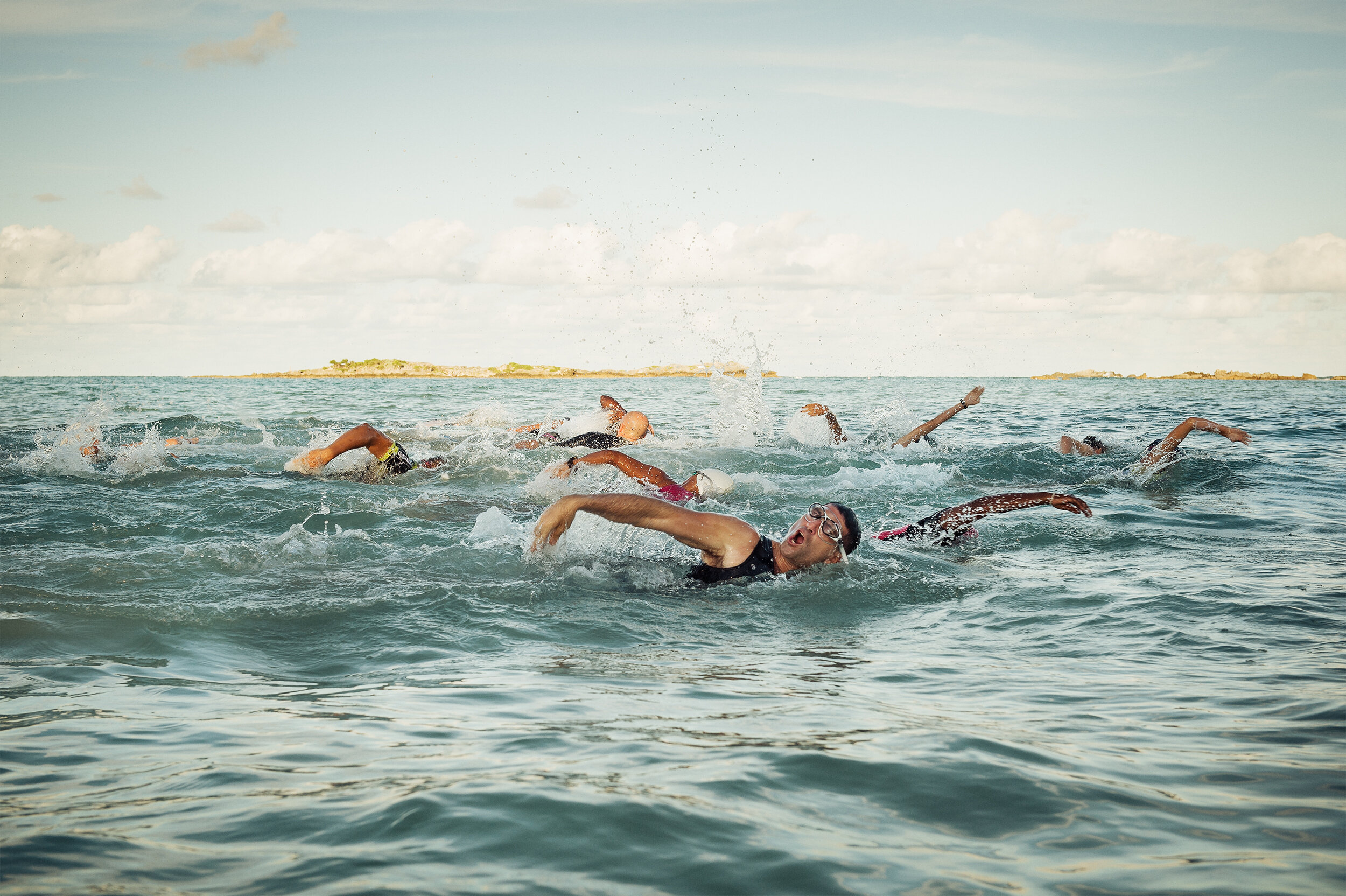 Triathlon swimmers competing in open water in Bermuda