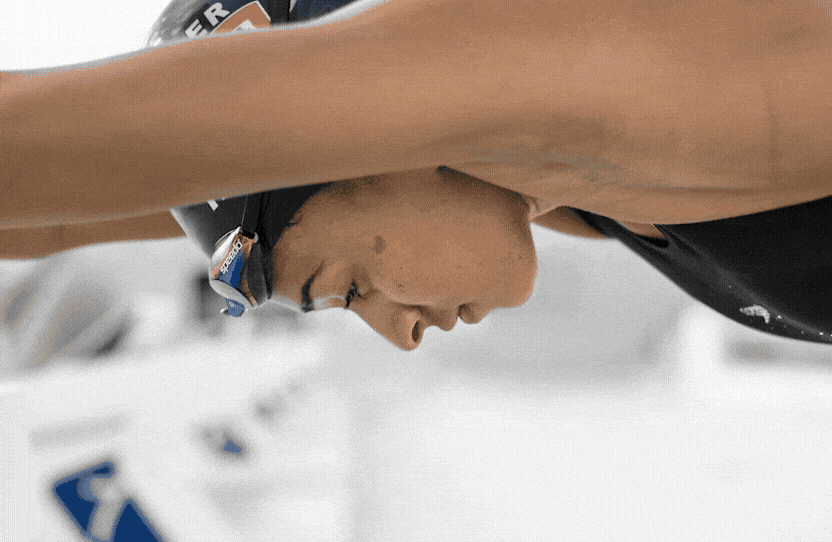 Swimmer Rebecca Heyliger at full stretch on the racing dive, shot in black and white