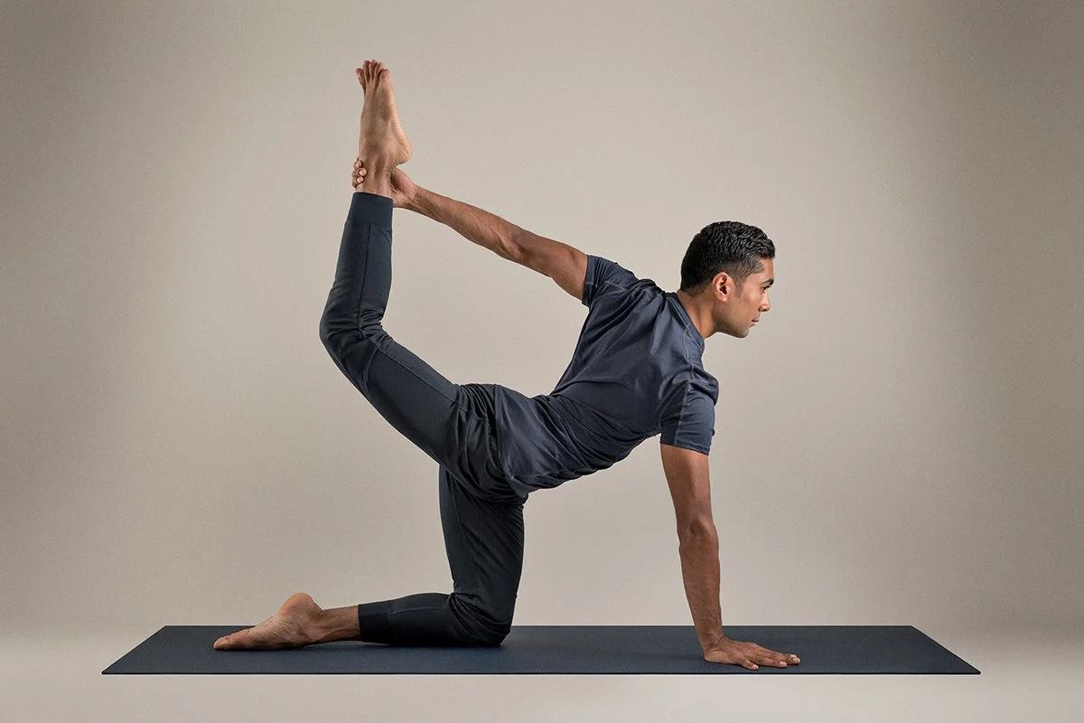  clean studio image of yoga teacher in pose 