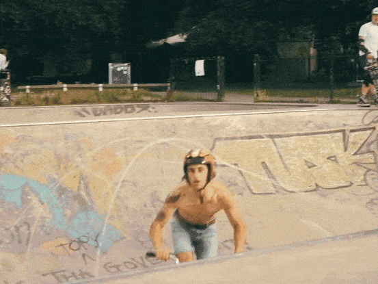 BMX riders in the concrete bowl at Clissold Park skatepark, north London