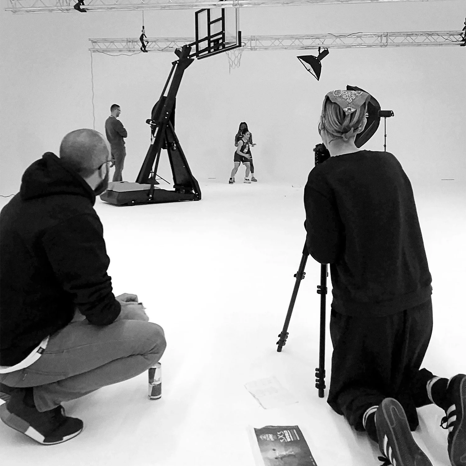 Behind the scenes on a studio basketball campaign shoot, Karen Yeomans working with the client on set