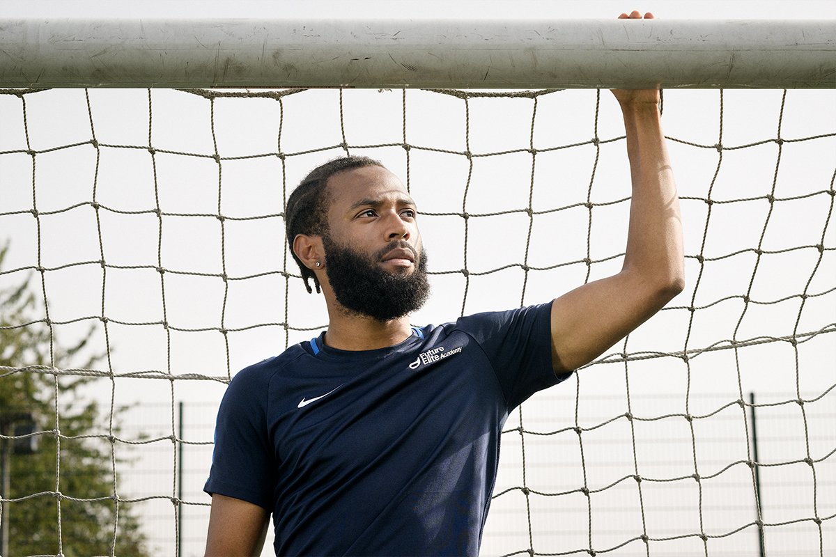  Male football player standing in goal 