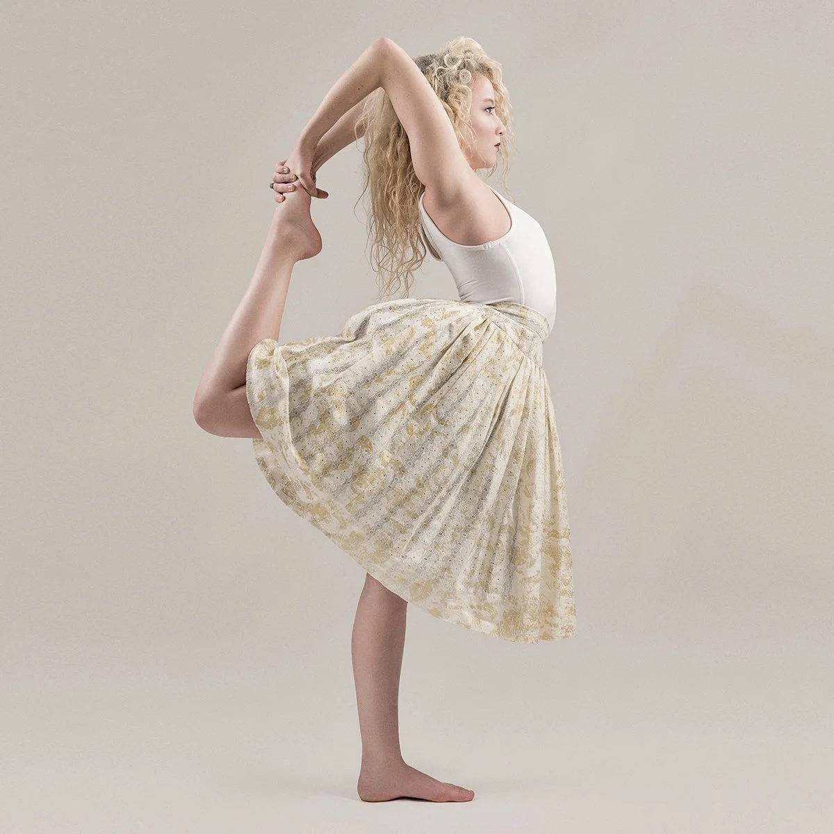  Yoga teacher in studio Natarajasana dancer pose 
