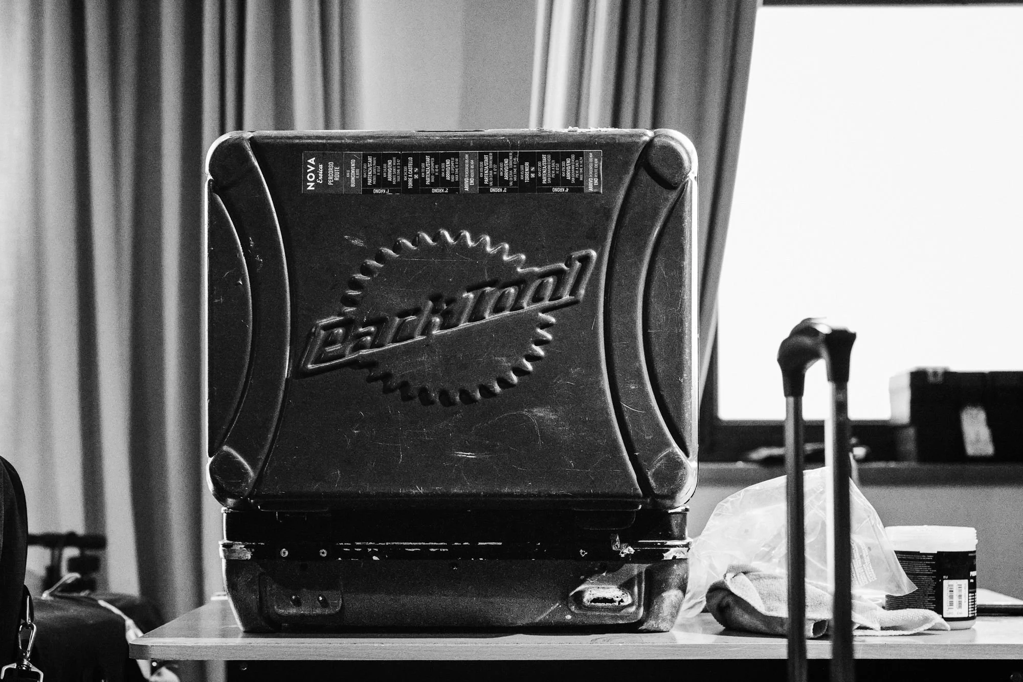 Black and white detail of a bike mechanic's tool case on a table
