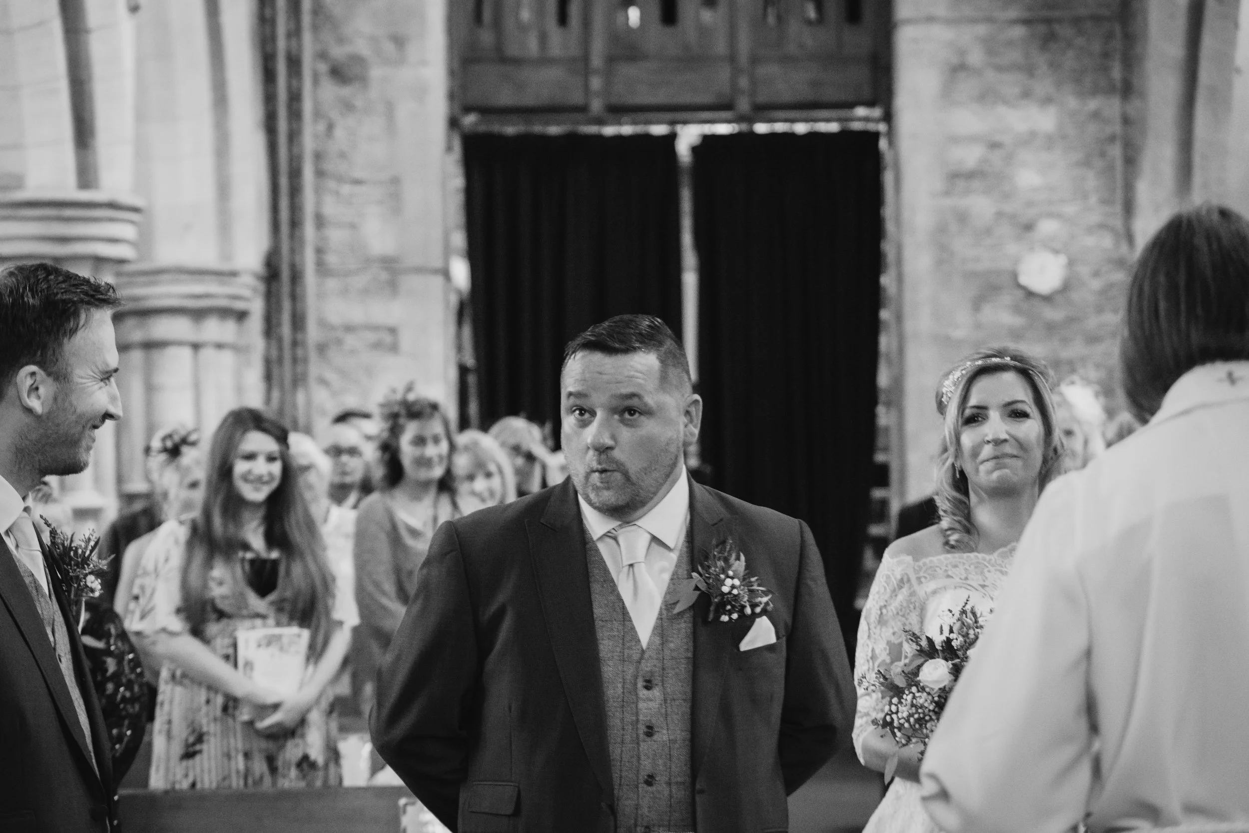 groom excited bride coming down aisle st peters bottesford