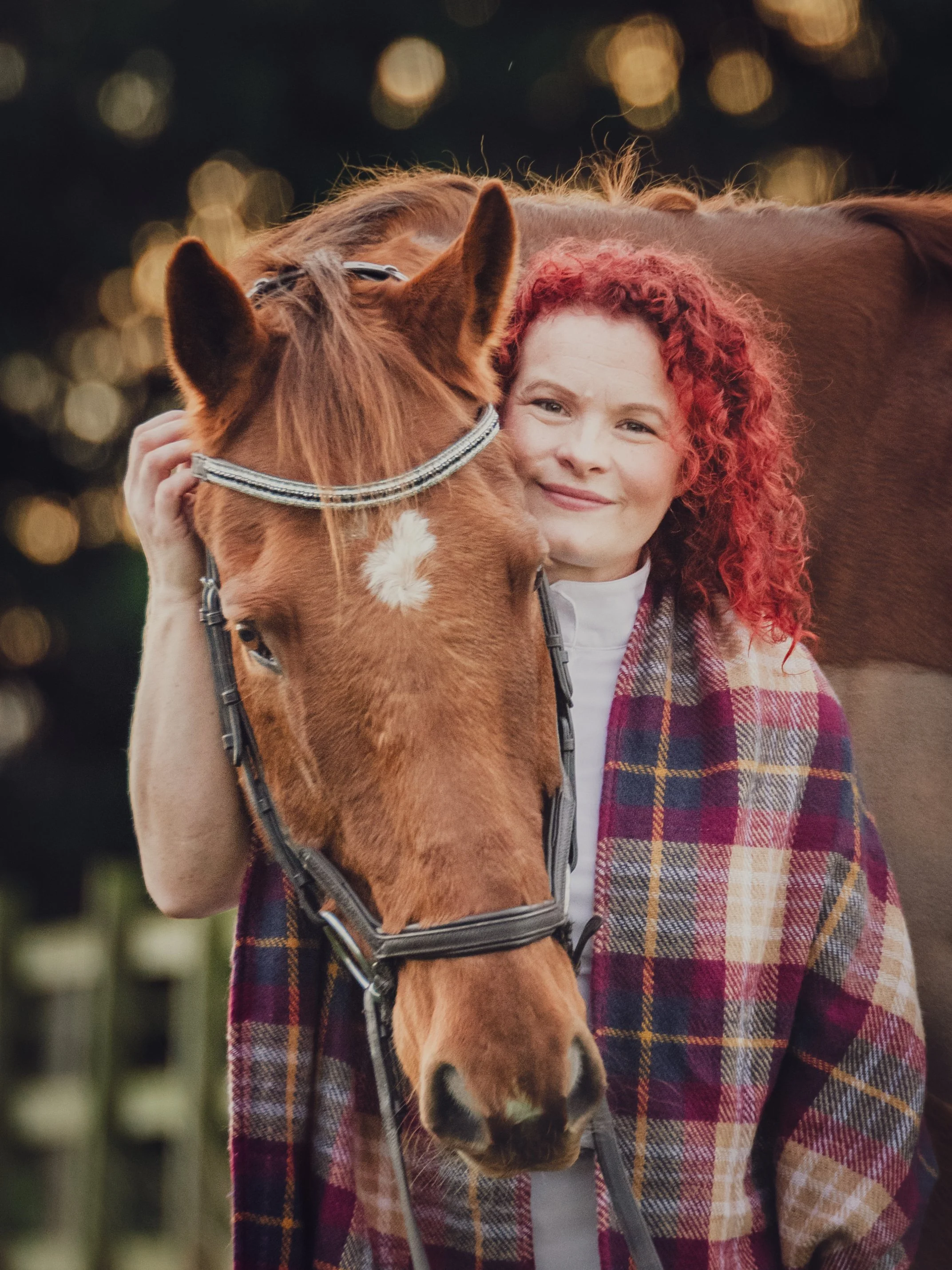 autumn equestrian photoshoot red haired lady and chestnut thoroughbred horse