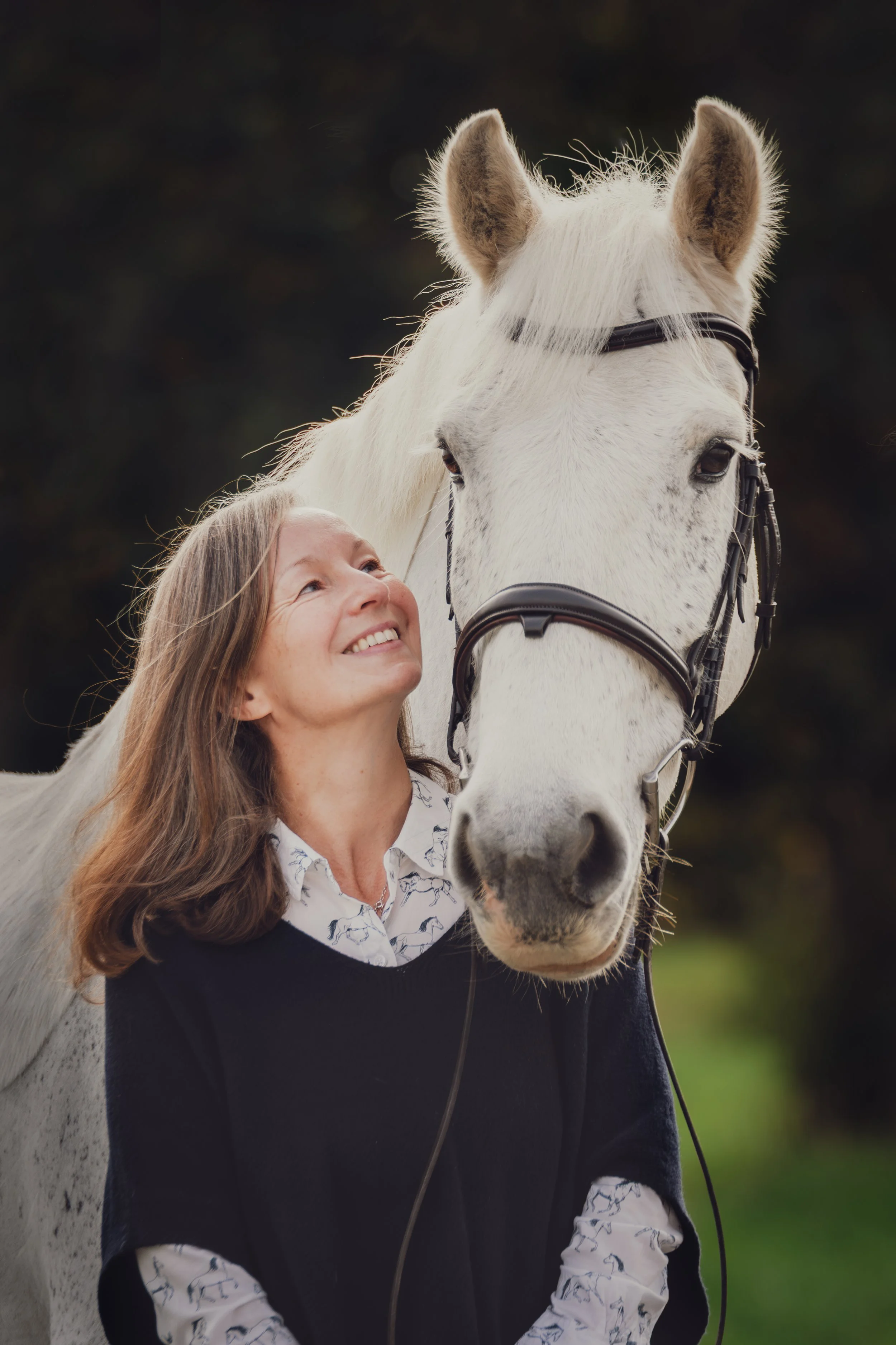 horse and owner back light autumn photoshoot