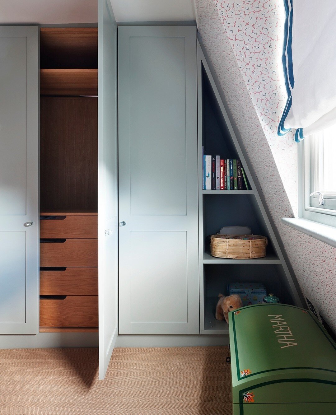 Good storage is so important in a bedroom.  This custom wardrobe and shelving filled an awkward nook (in the same bedroom we posted yesterday!) and created the perfect place to hide clothes, store precious belongings and display favourite books.  The