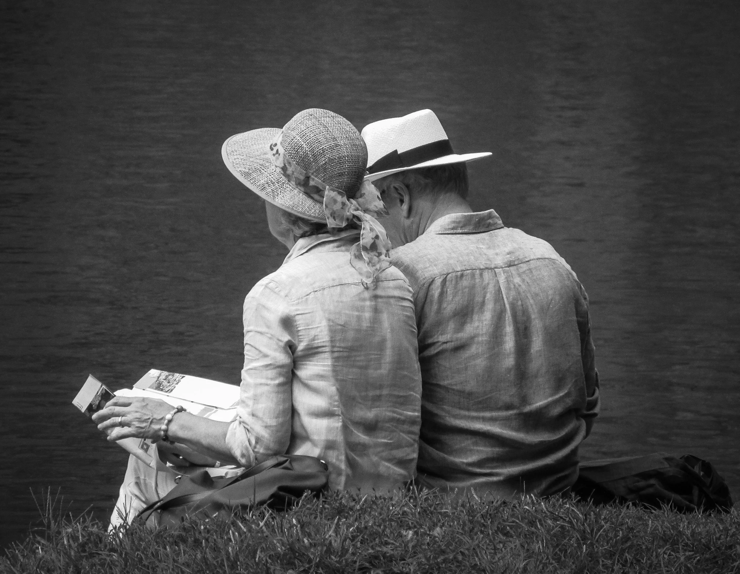 Back of old man and woman sitting together