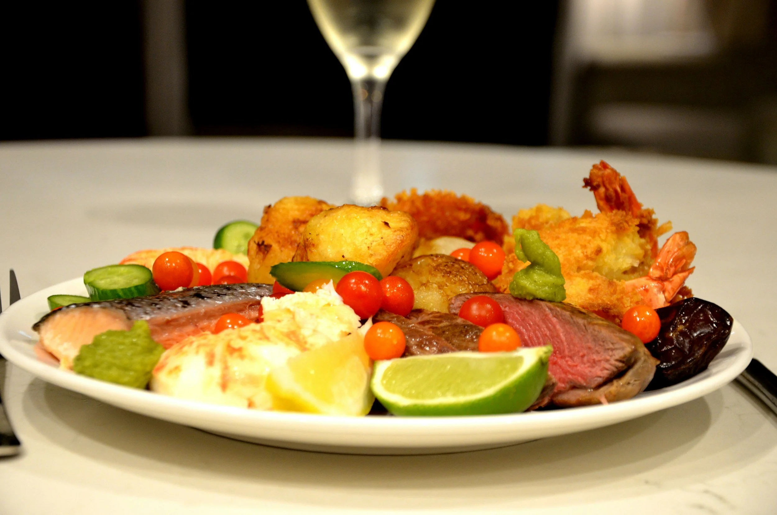 A plated meal with a variety of food, representing meal allowances under per diem guidelines. Lima Charlie Inc. ensures proper per diem management for emergency lodging operations.