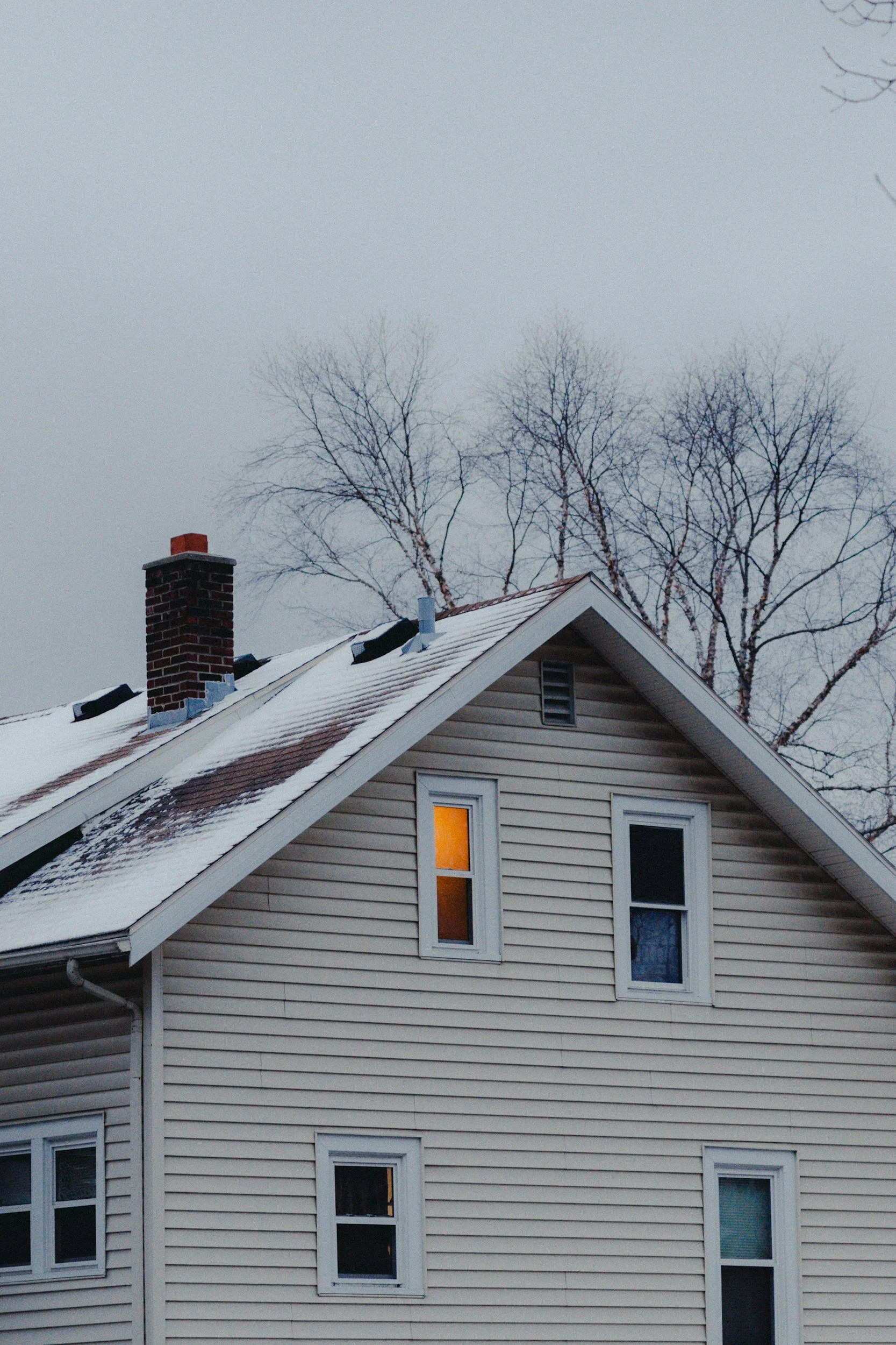 Residential home during winter conditions, representing Lima Charlie Inc.’s role in providing stable corporate lodging solutions when weather disrupts workforce operations.