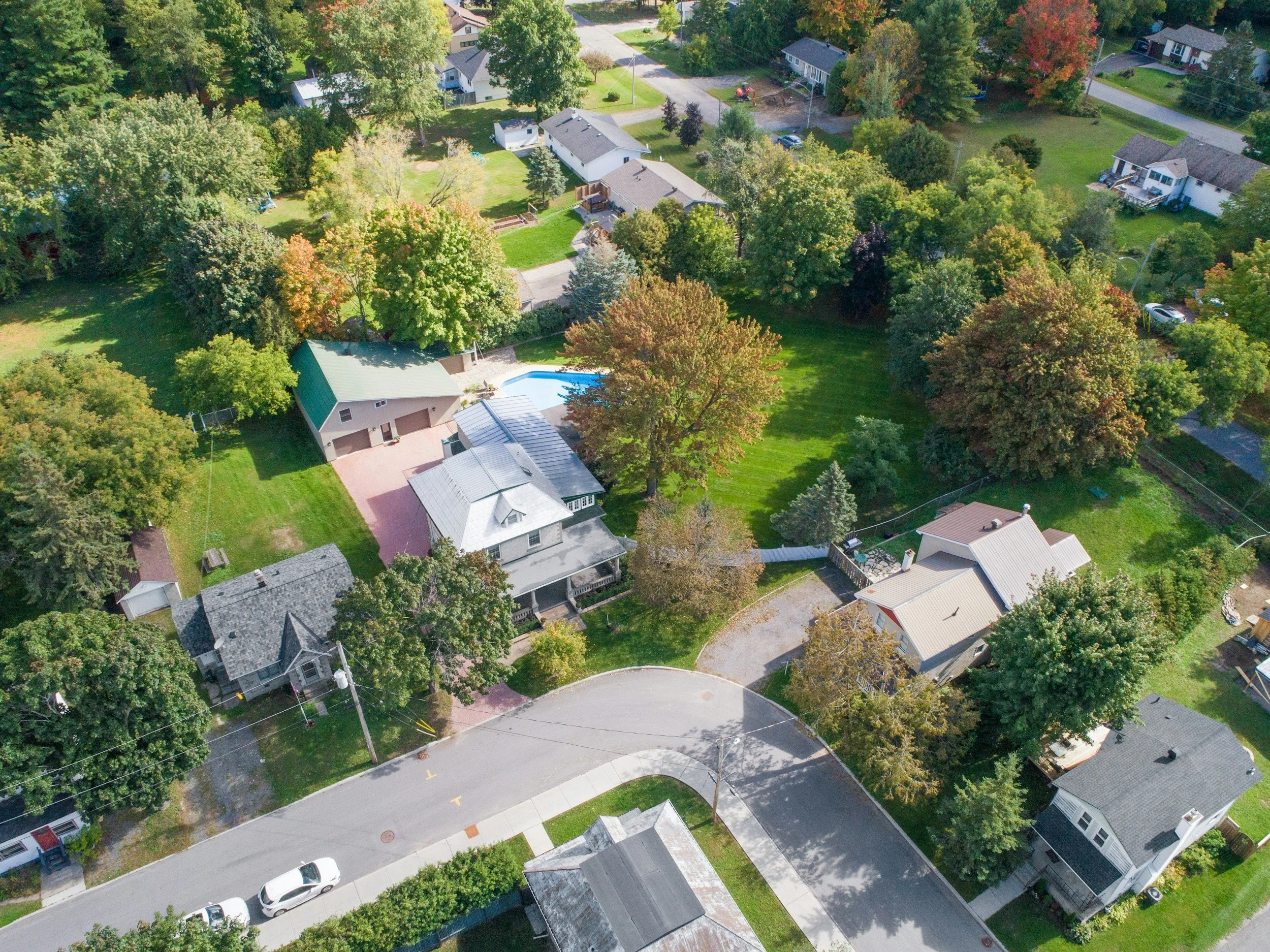 Aerial view of a residential neighborhood with multiple single-family homes, illustrating scalable property partnerships that support nationwide corporate and government lodging networks through Lima Charlie Inc.