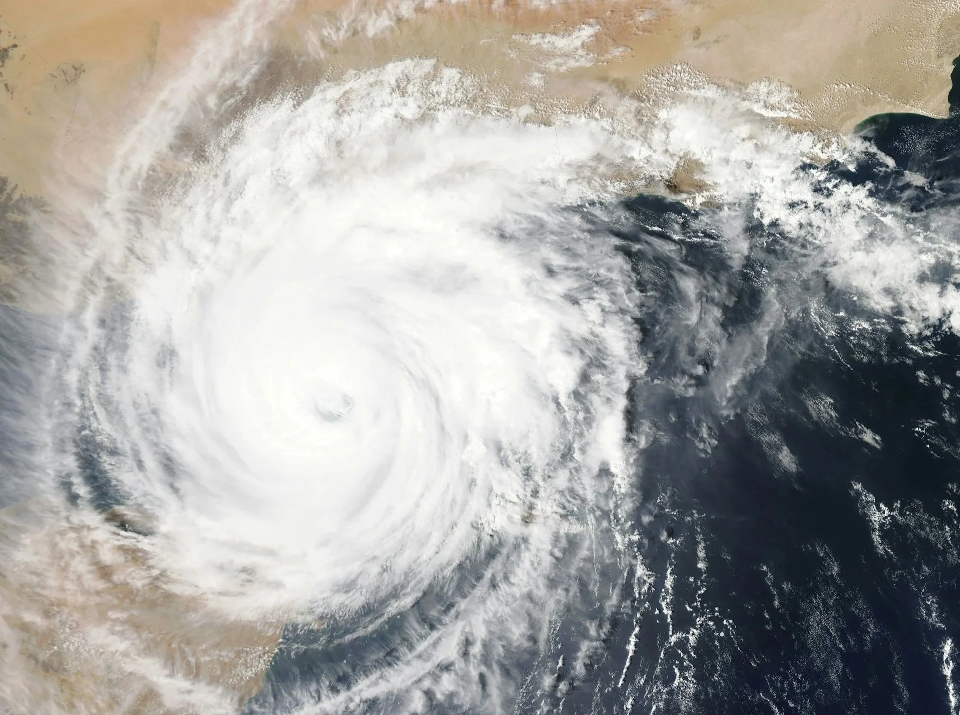 Satellite view of a major hurricane approaching land, representing large-scale disaster events where Lima Charlie Inc. supports emergency housing deployment and rapid response operations.”