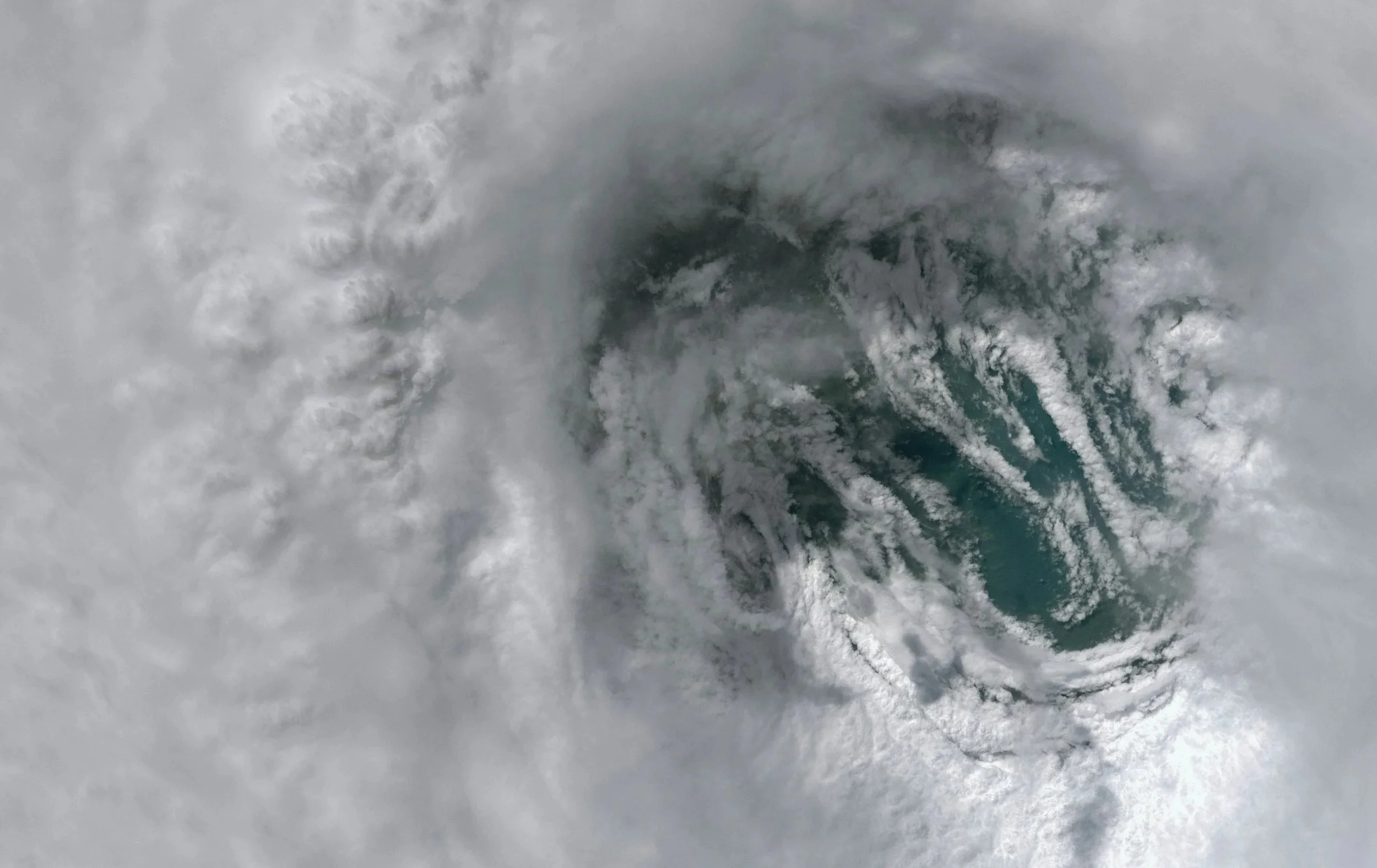 Overhead view of a large tropical storm with swirling clouds around its eye, the kind of threat behind Guam typhoon readiness guidance from Lima Charlie Inc.