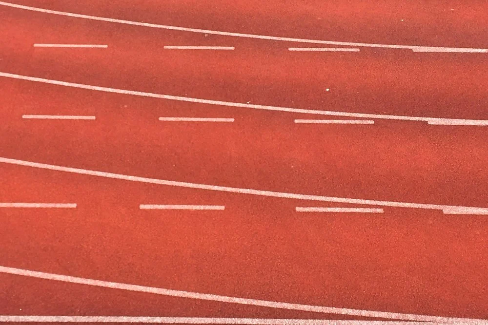  Photo of red track with white lines by Henry & Co. on Unsplash 