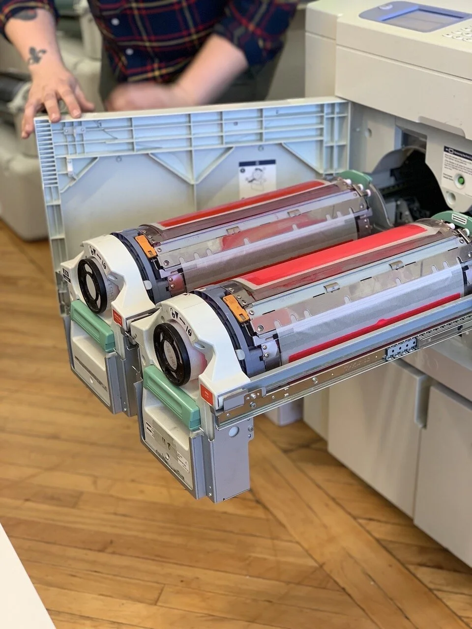  Ink drums (red, and fluorescent pink) loaded in to the Riso machine 