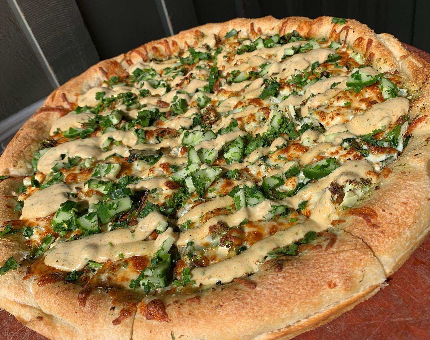 April Feature: The Green Goddess Pizza 🥦🥑

Our artisan dough topped with garlic butter, pesto, spinach, green cabbage, broccoli, leeks, goat cheese, roasted garlic and Edam &amp; mozzarella blend. Finished with a fresh cilantro cucumber lime topper