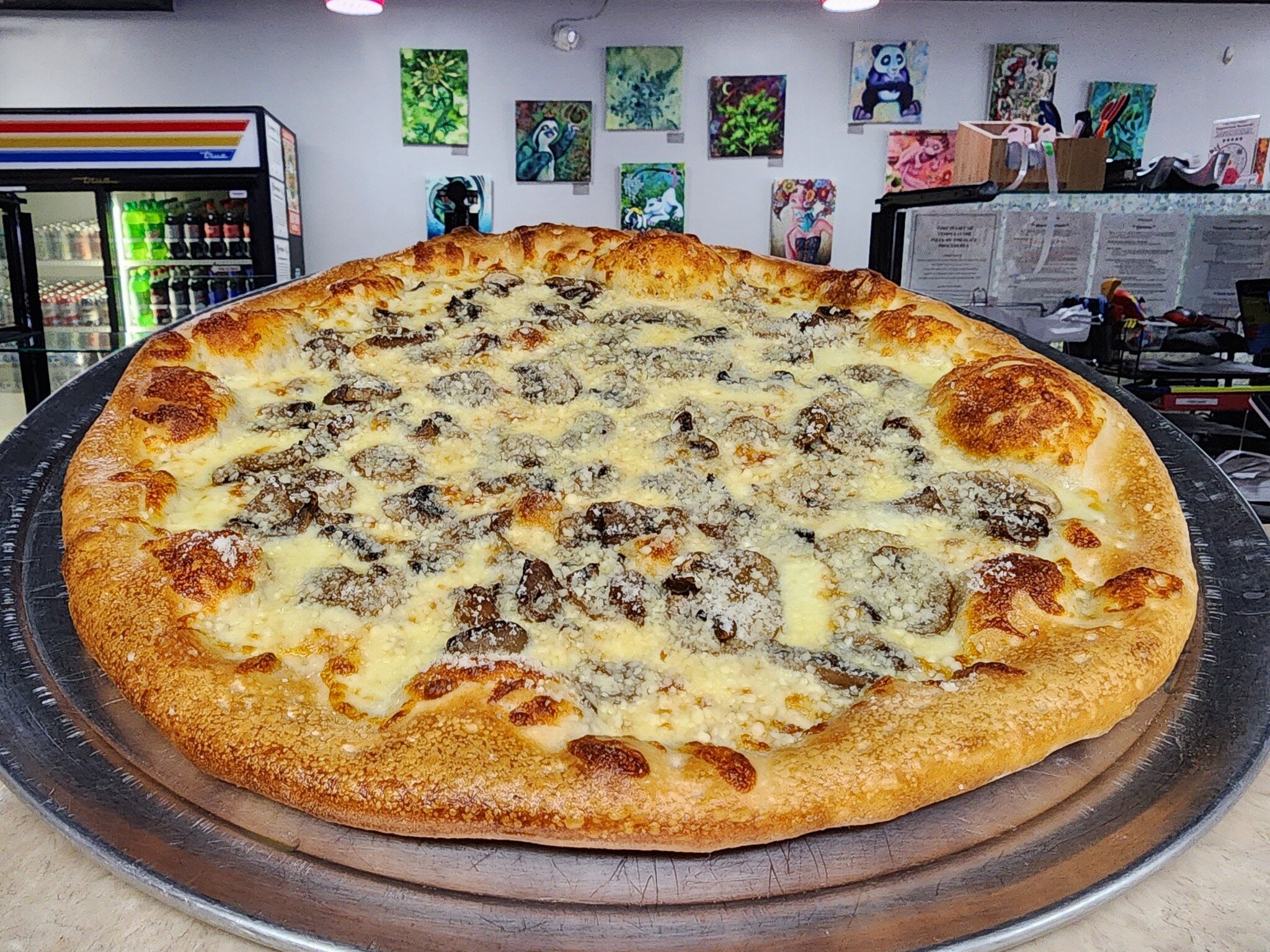 Introducing our Mucho Mushroom Pizza! We start with an Olive Oil Base, Mozzarella Cheese, Traditional Mushrooms, and Fresh Mushrooms. After the bake we top with LOTS of Parmesan Cheese. No additions/substitutions on this already-delicious pizza.

Sta
