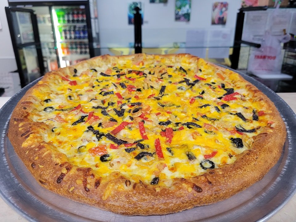 It's Pizza Friday!!! 🎉 

Introducing our Chicken Nacho Pizza! We start with a Cheese Sauce Base and add Taco Seasoning, Mozzarella Cheese, Chicken, Black Olive, Tomato, White Onion, and top with Tortilla Strips and Cheddar Cheese. Served with Sour C