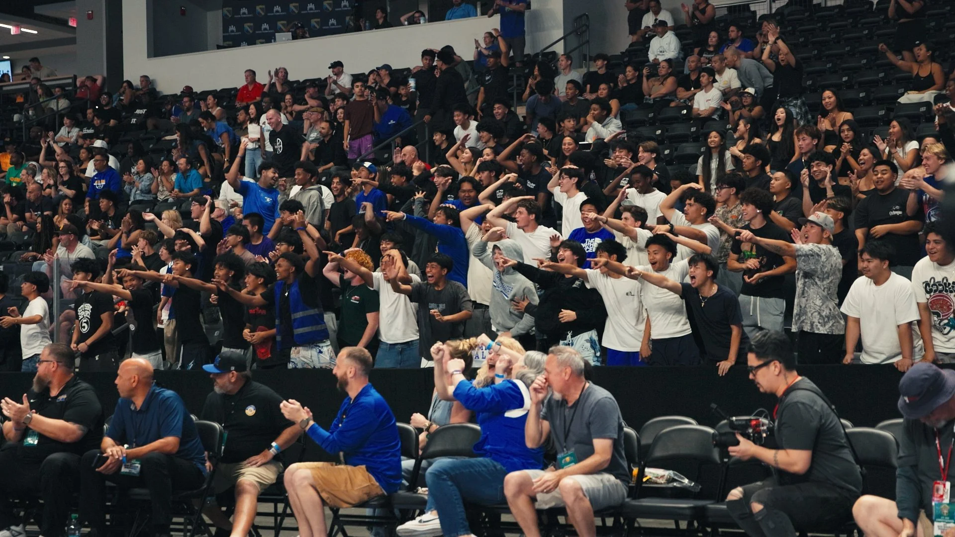 Students from Mira Mesa High School celebrating a dunk by their team in the 2026 CIF SDS Championship