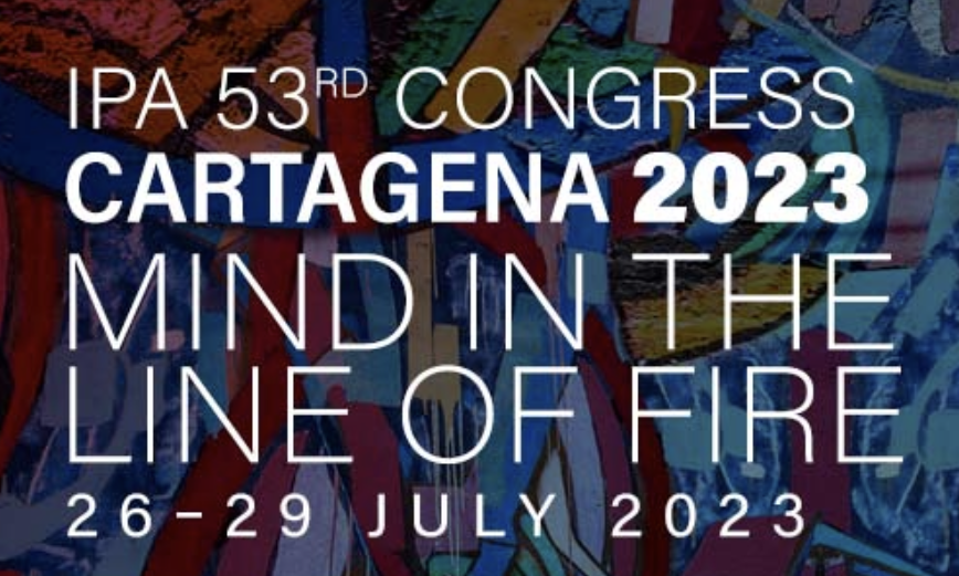 Poster for the IPA 53rd Congress in Cartagena 2023, titled 'Mind in the Line of Fire,' held from July 26 to 29, 2023, featuring colorful abstract artwork in the background.