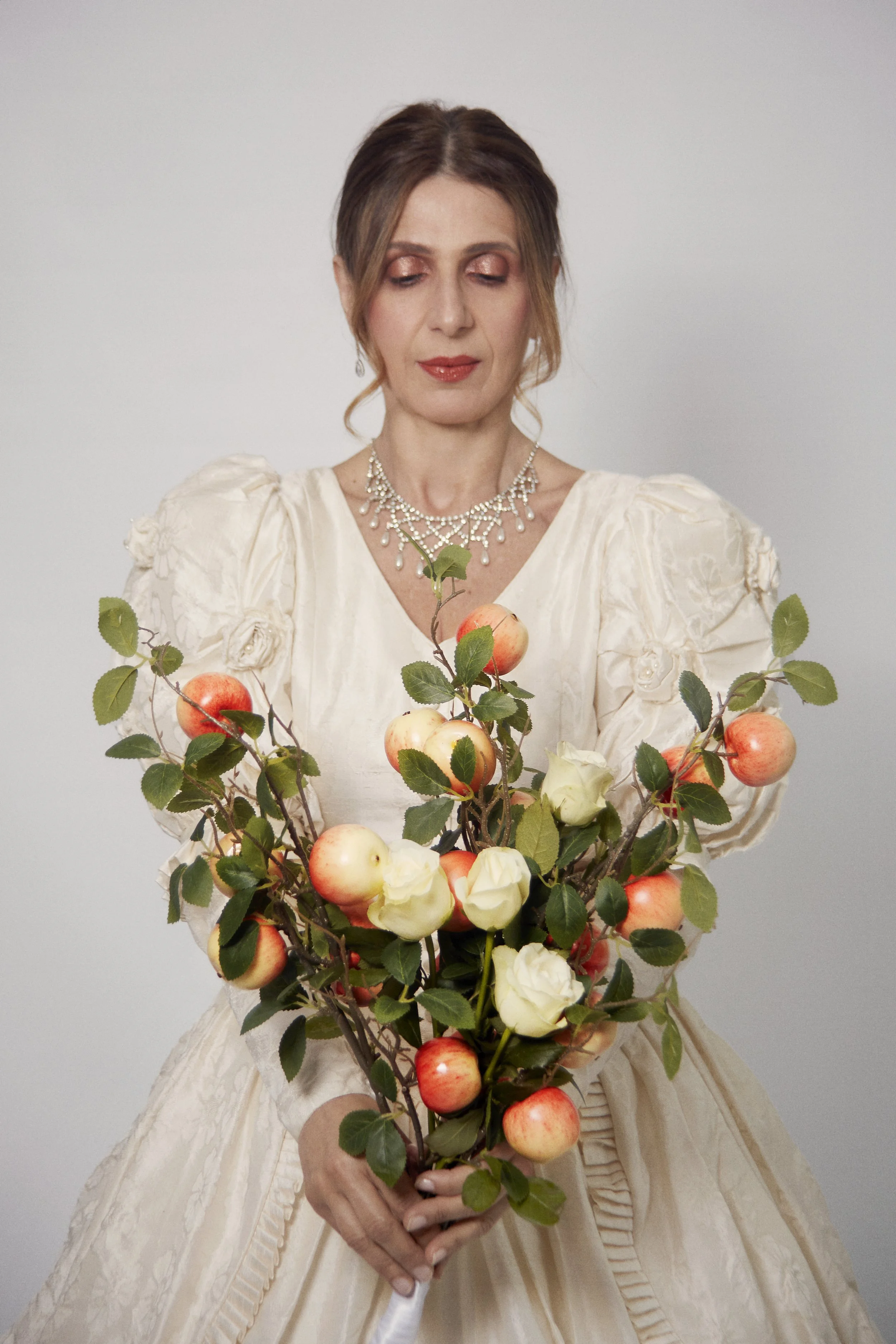 Portrait of La Novia holding an apple bouquet, Cuerpo Vestido, Alma Desnuda