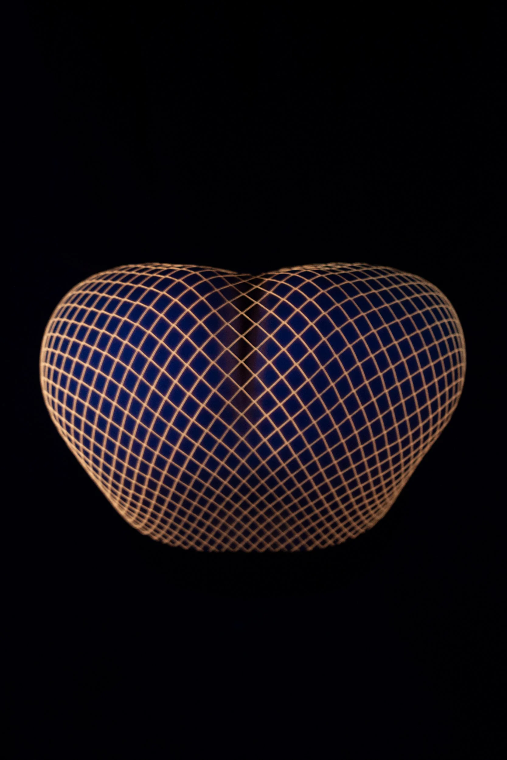 Close-up photograph of a female body wearing fishnet stockings forming abstract patterns from the conceptual photography series MISShapes by Beatriz Perez. 