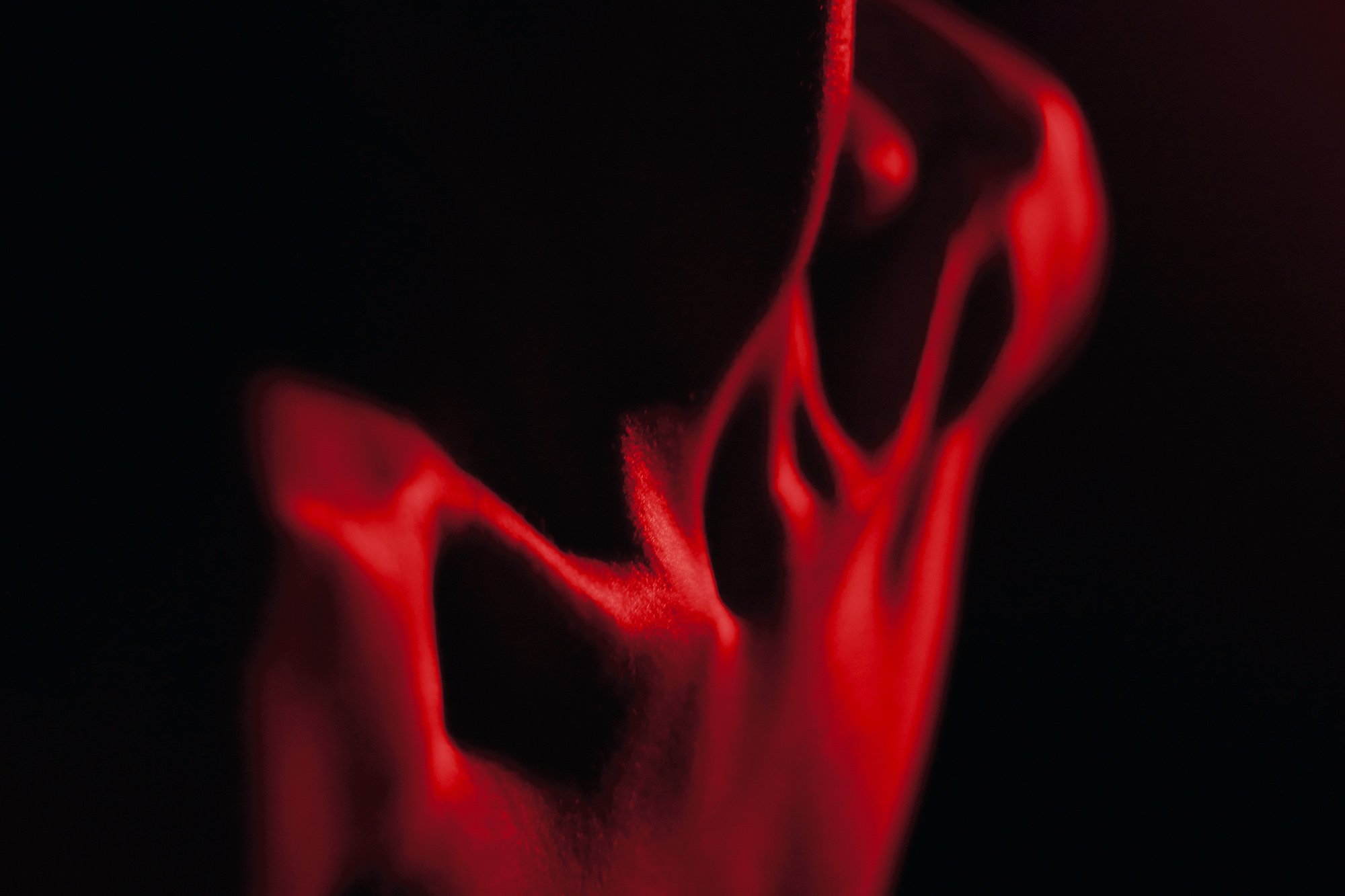 Close-up photograph of female collarbones highlighted by sculptural lighting from the series MISShapes by Beatriz Perez. 