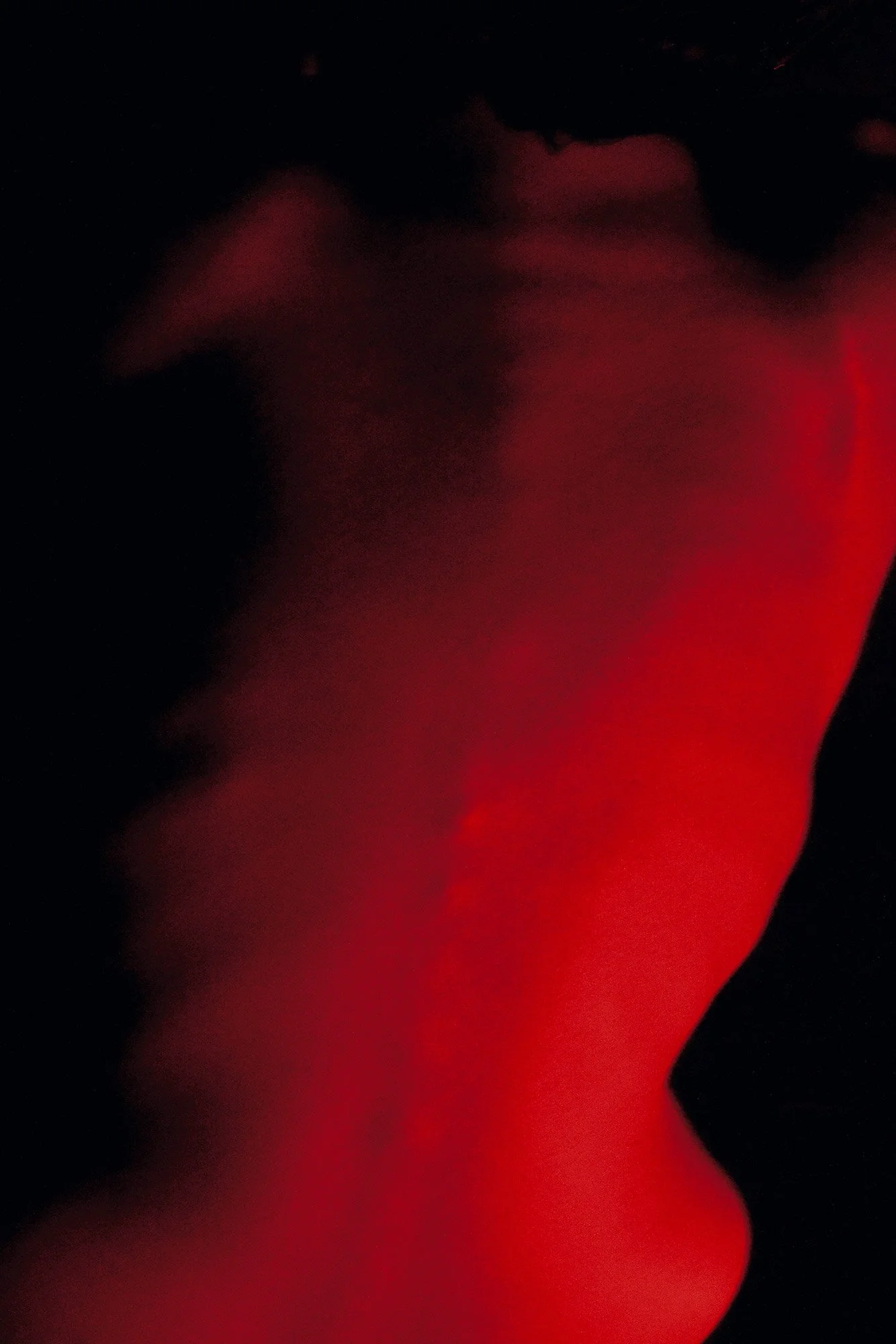 Abstract photographic study of a female torso shaped by dramatic light and shadow from the series MISShapes by Beatriz Perez.