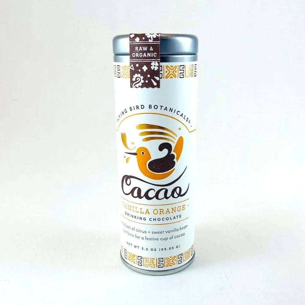 Tin of organic drinking chocolate flavored with orange and vanilla