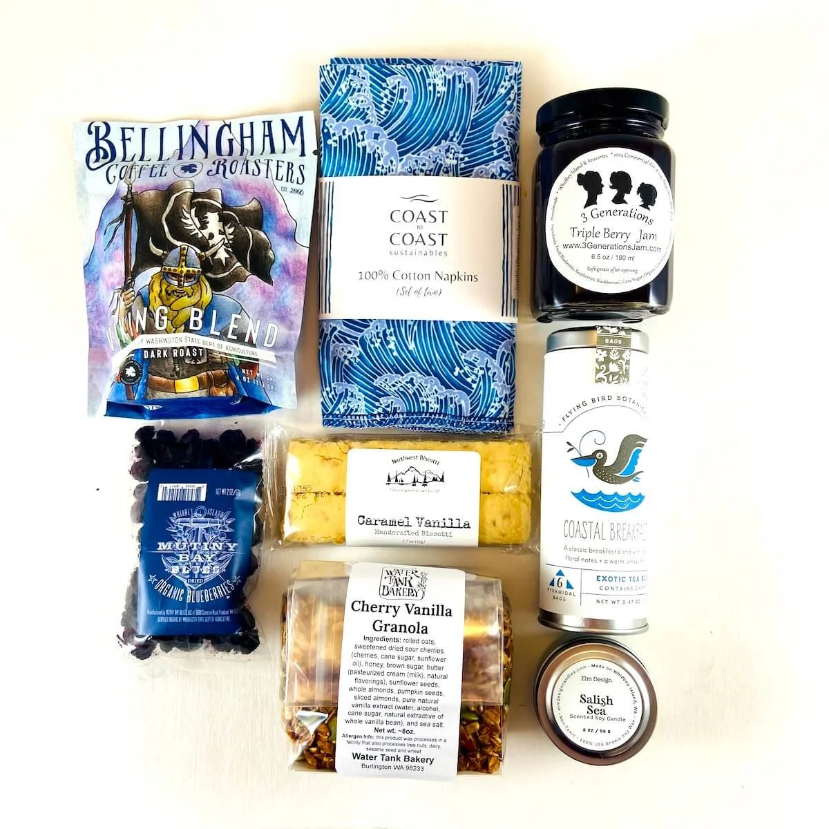 Coastal Brunch gift box goods including granola, coffee, tea, fruit, and candle