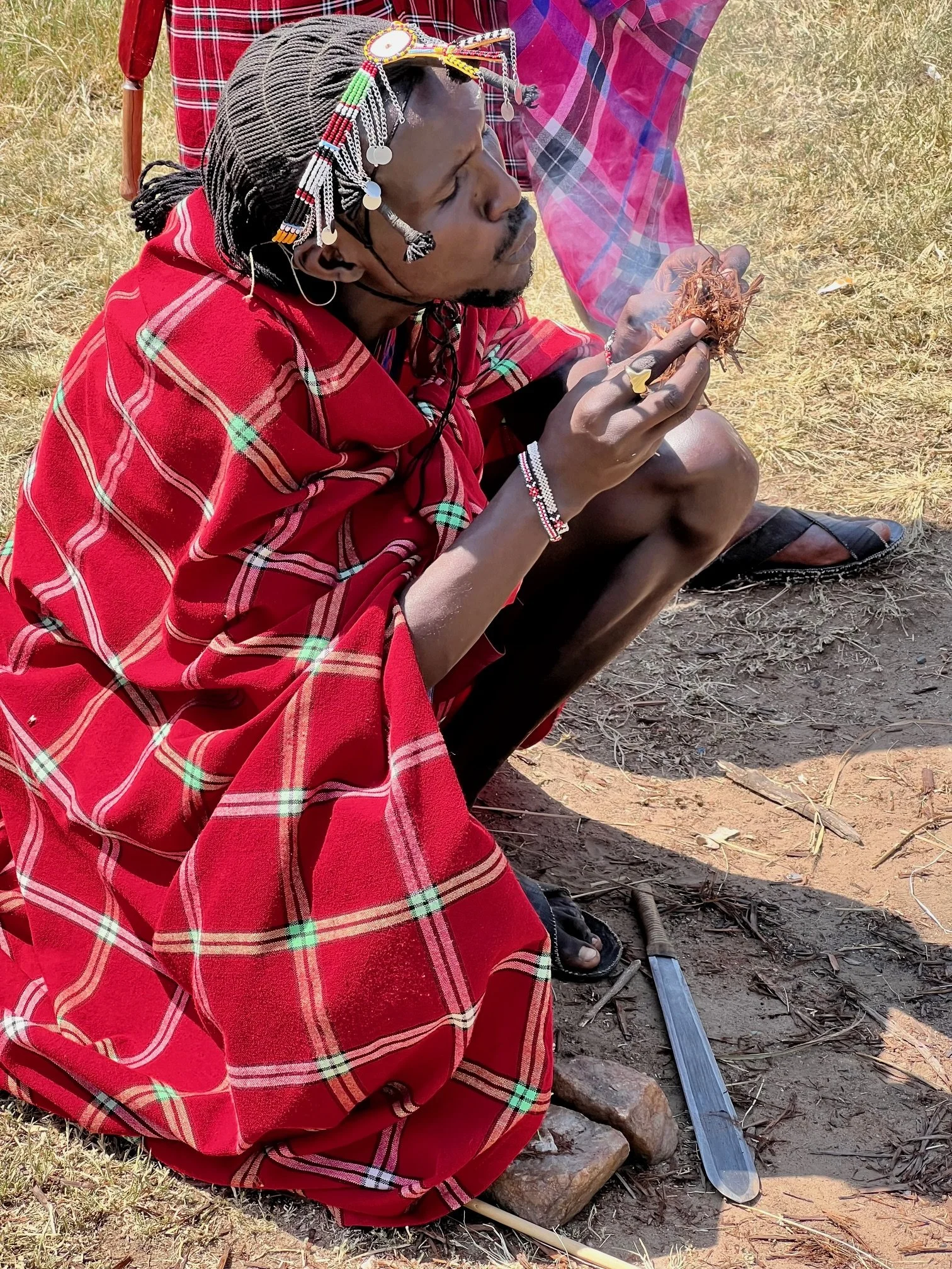 Kenya Maasai Village starting a fire.jpg
