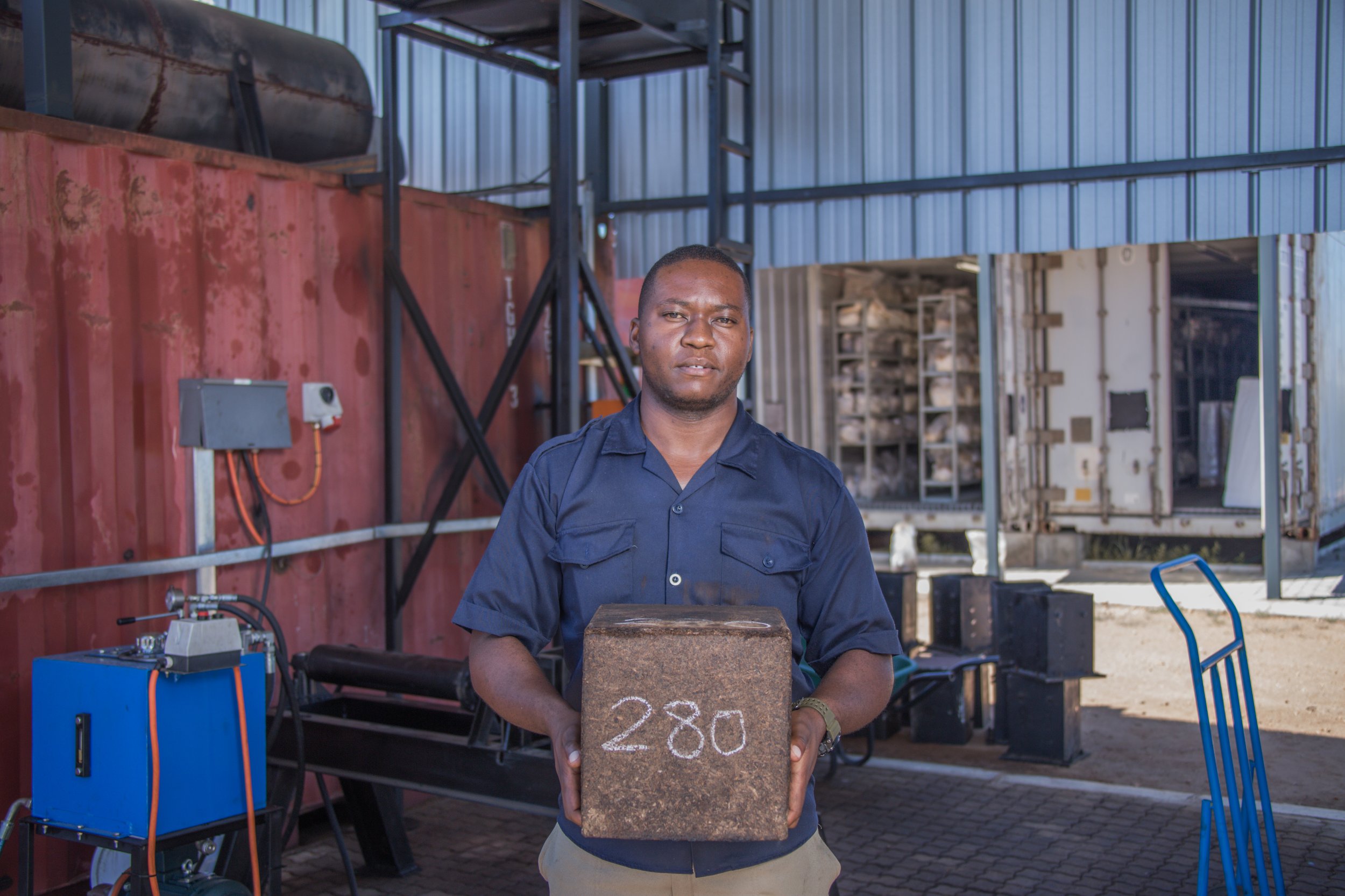 Ivan Severus holding 10kg mycoblock. Mycoblocks are made from the waste of mushroom farming which is made from the waste of bush clearing. Credit Standard bank Namibia.
