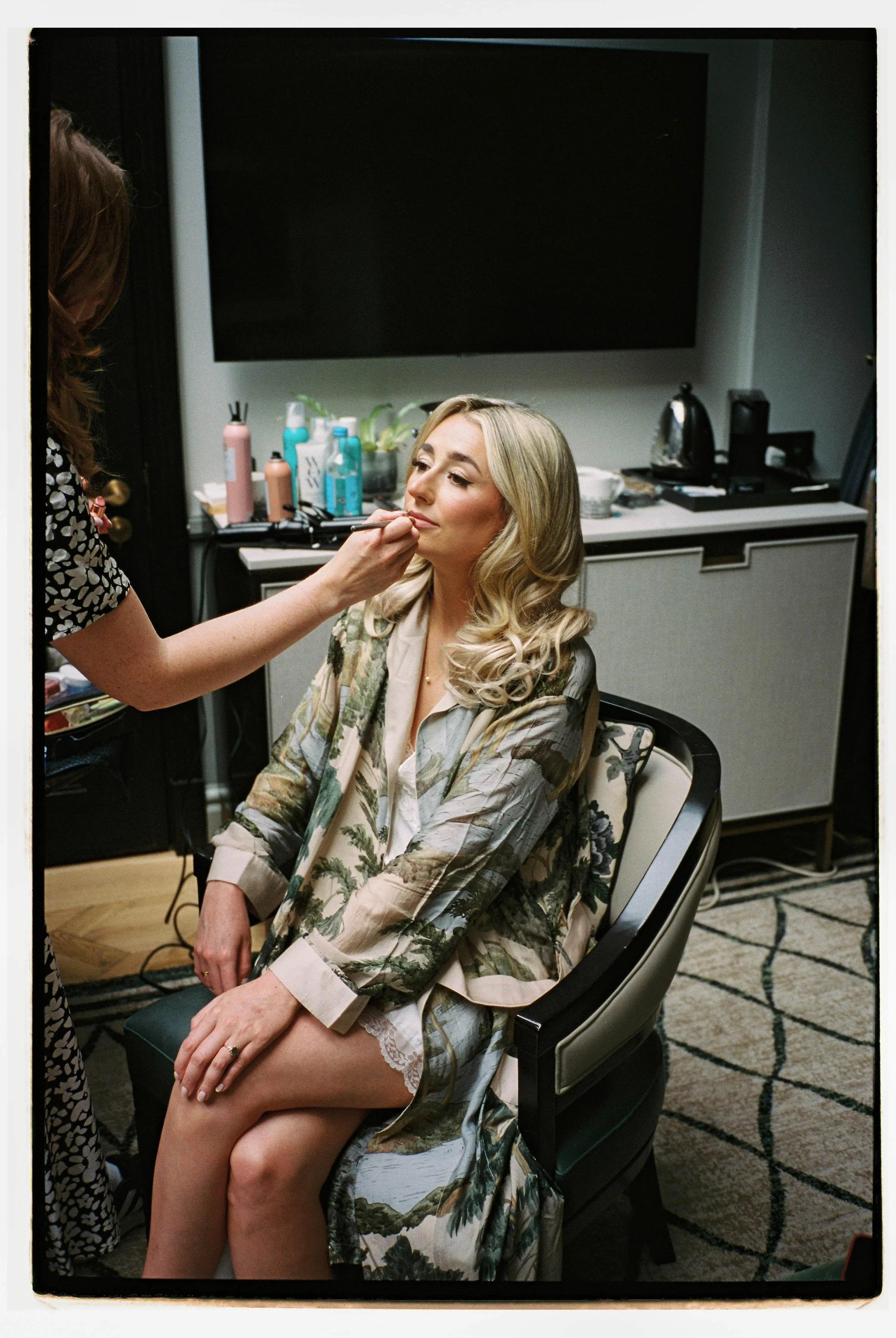 Bride having her wedding makeup applied
