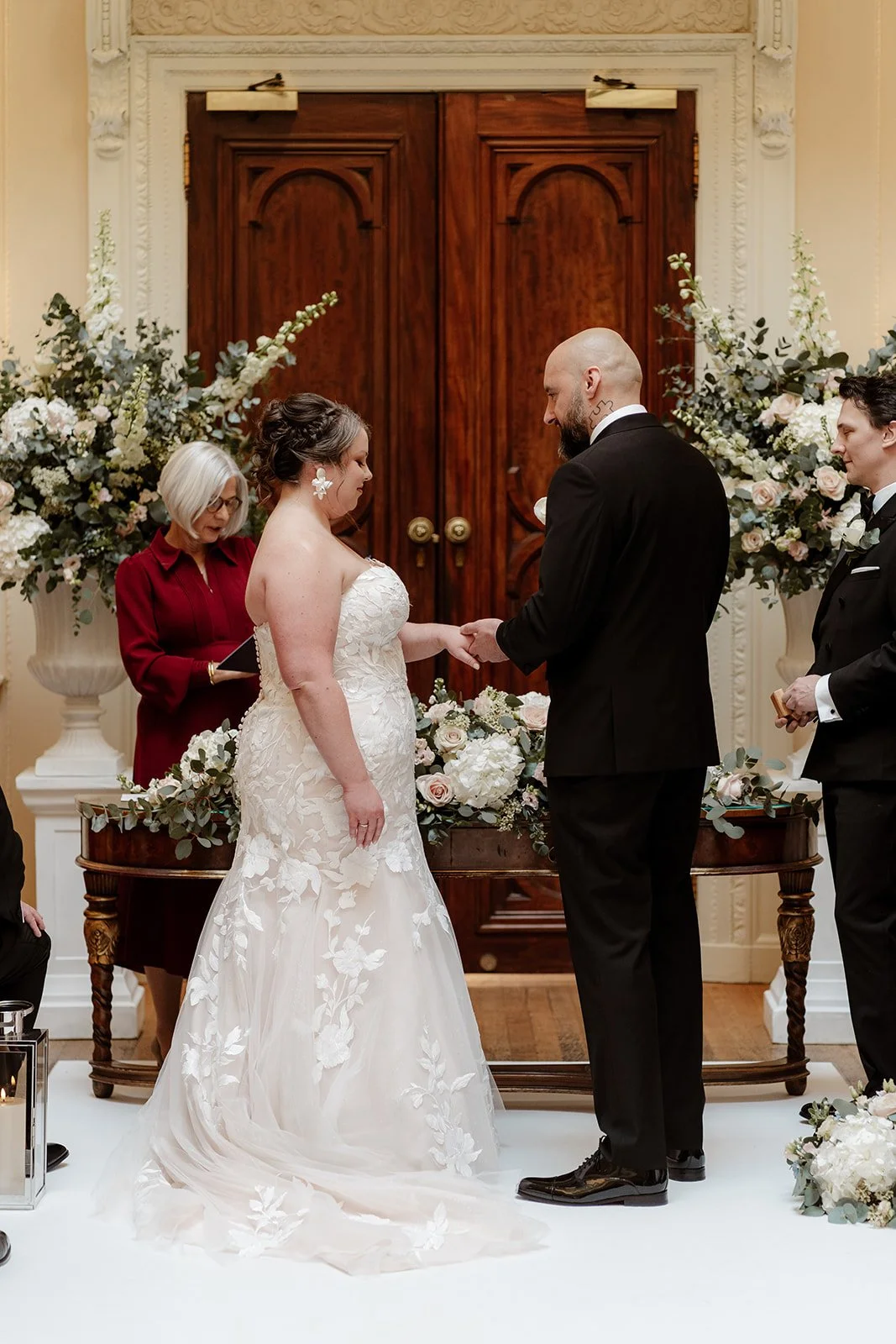 a bride and groom during their ceremony at Hedsor House wedding venue