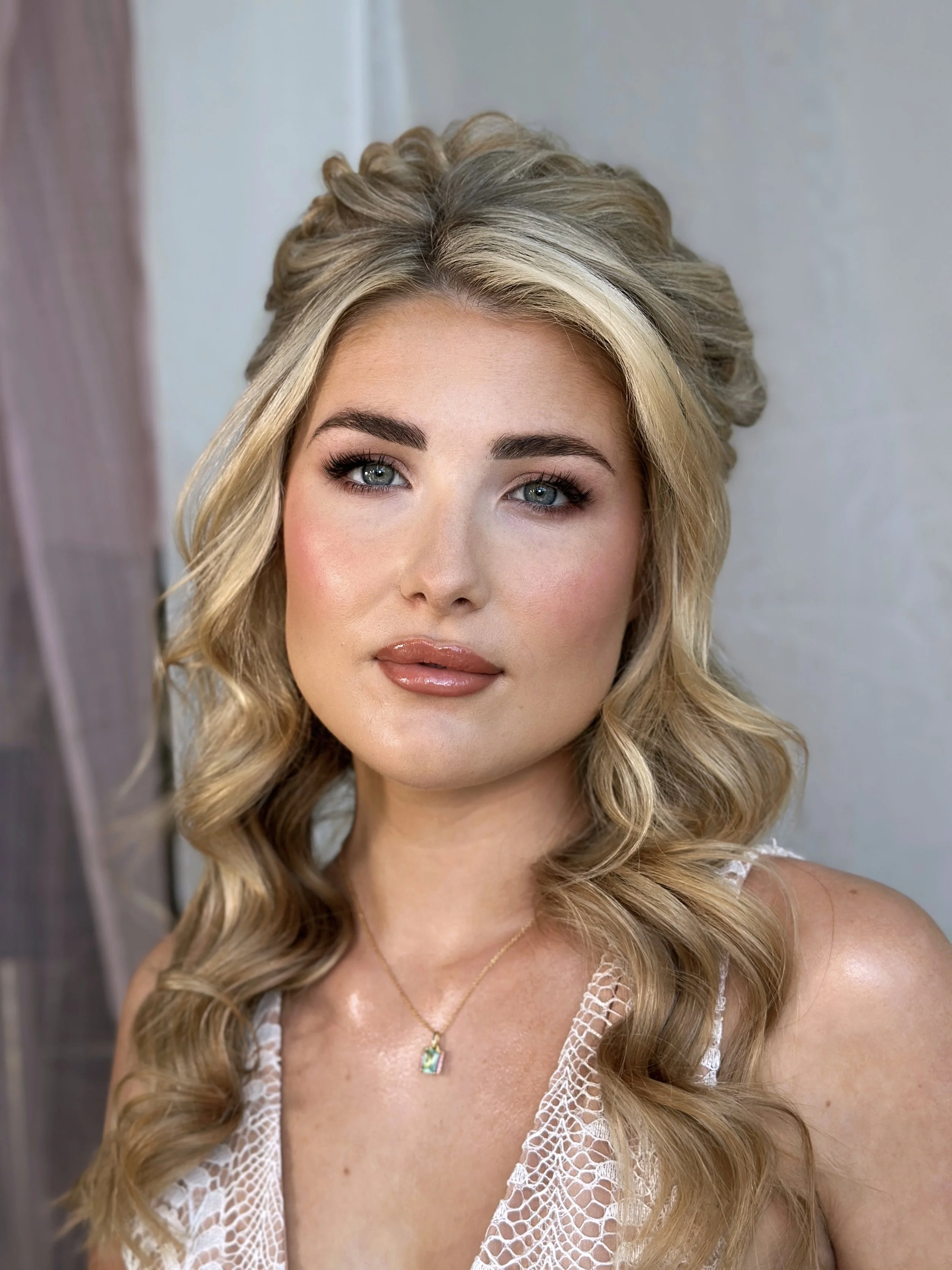 Soft glam bridal makeup look and boho hairstyle