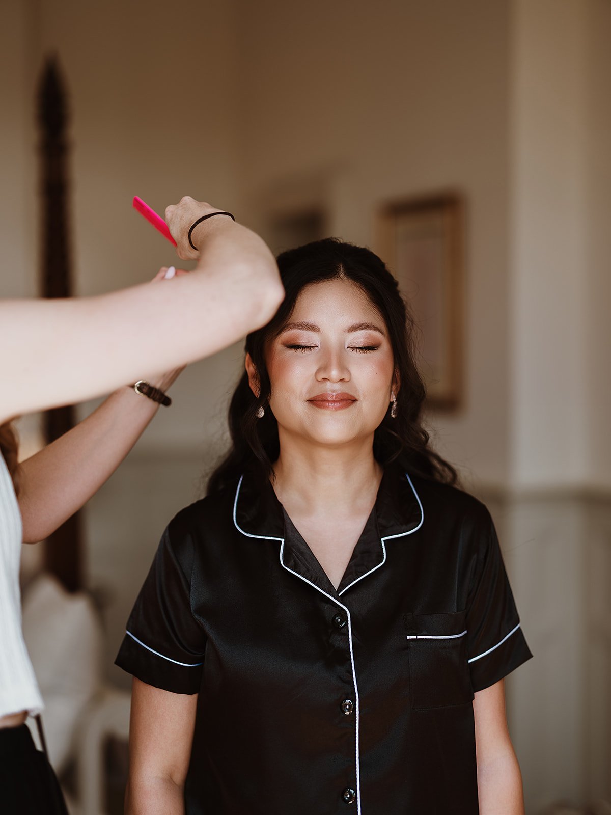 Bride having final hair touches on her wedding morning at Highley Manor wedding venue