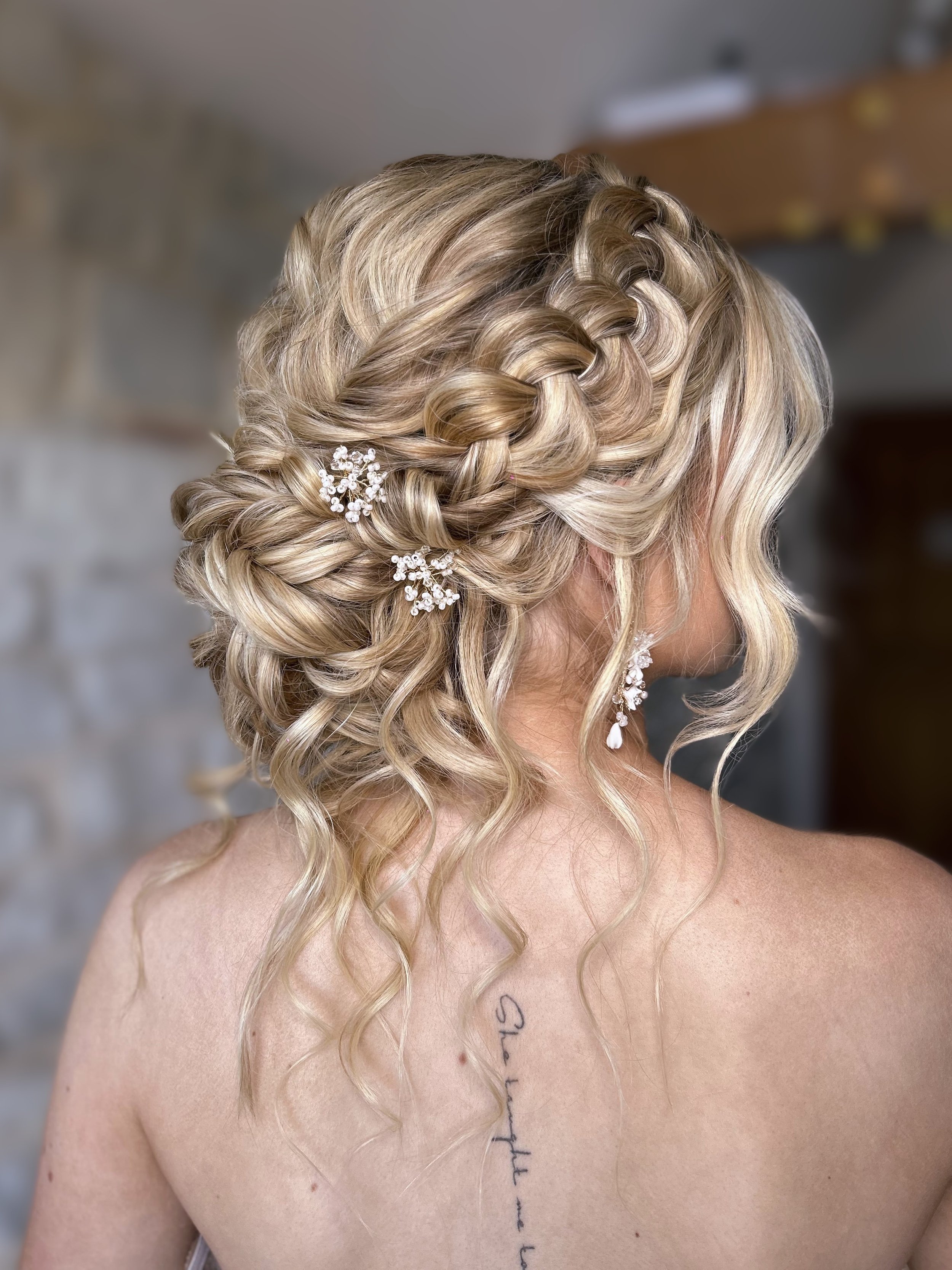 Boho wedding hair with curls and braids on blonde hair