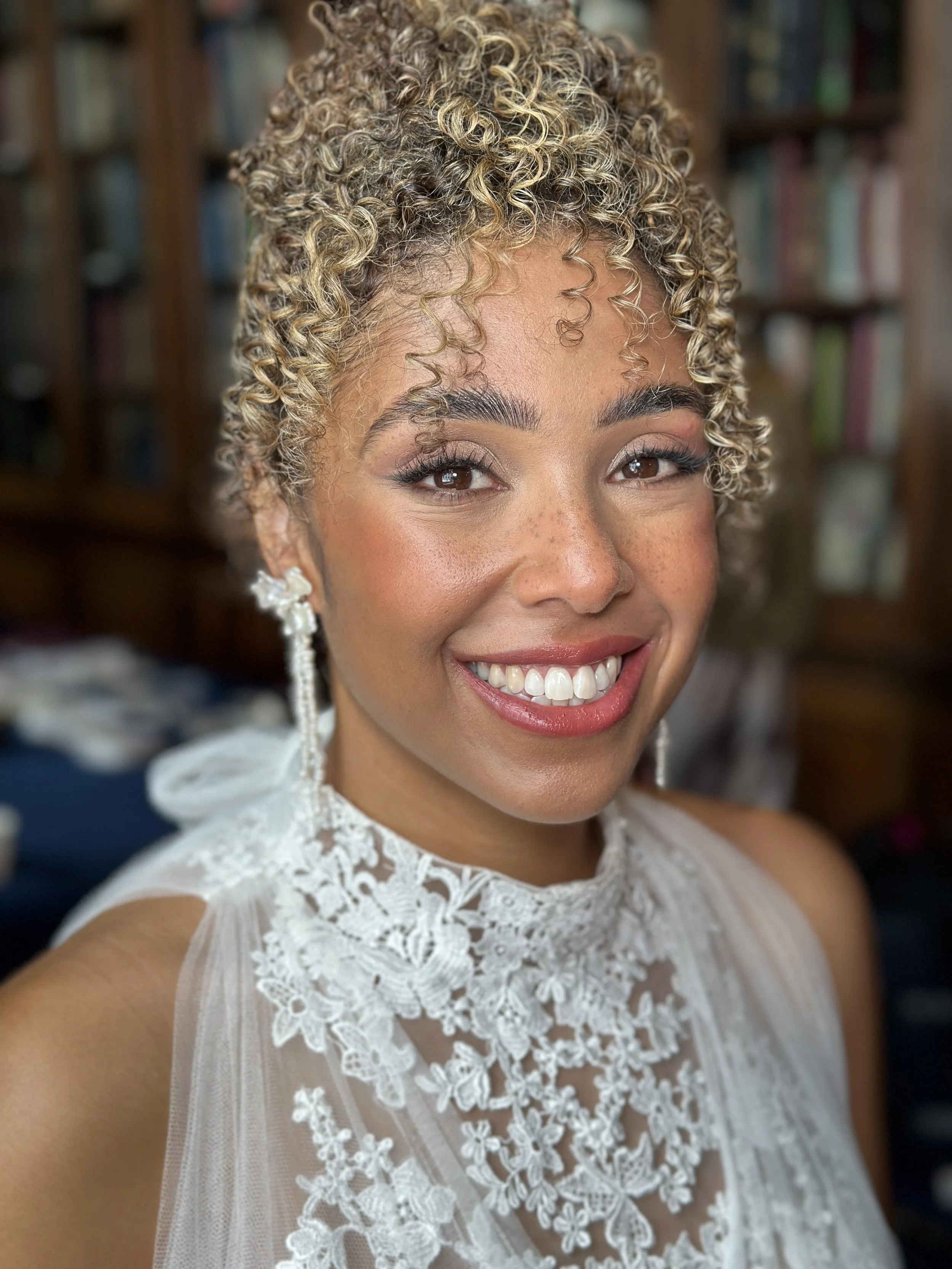Soft glam bridal makeup and curly hair updo