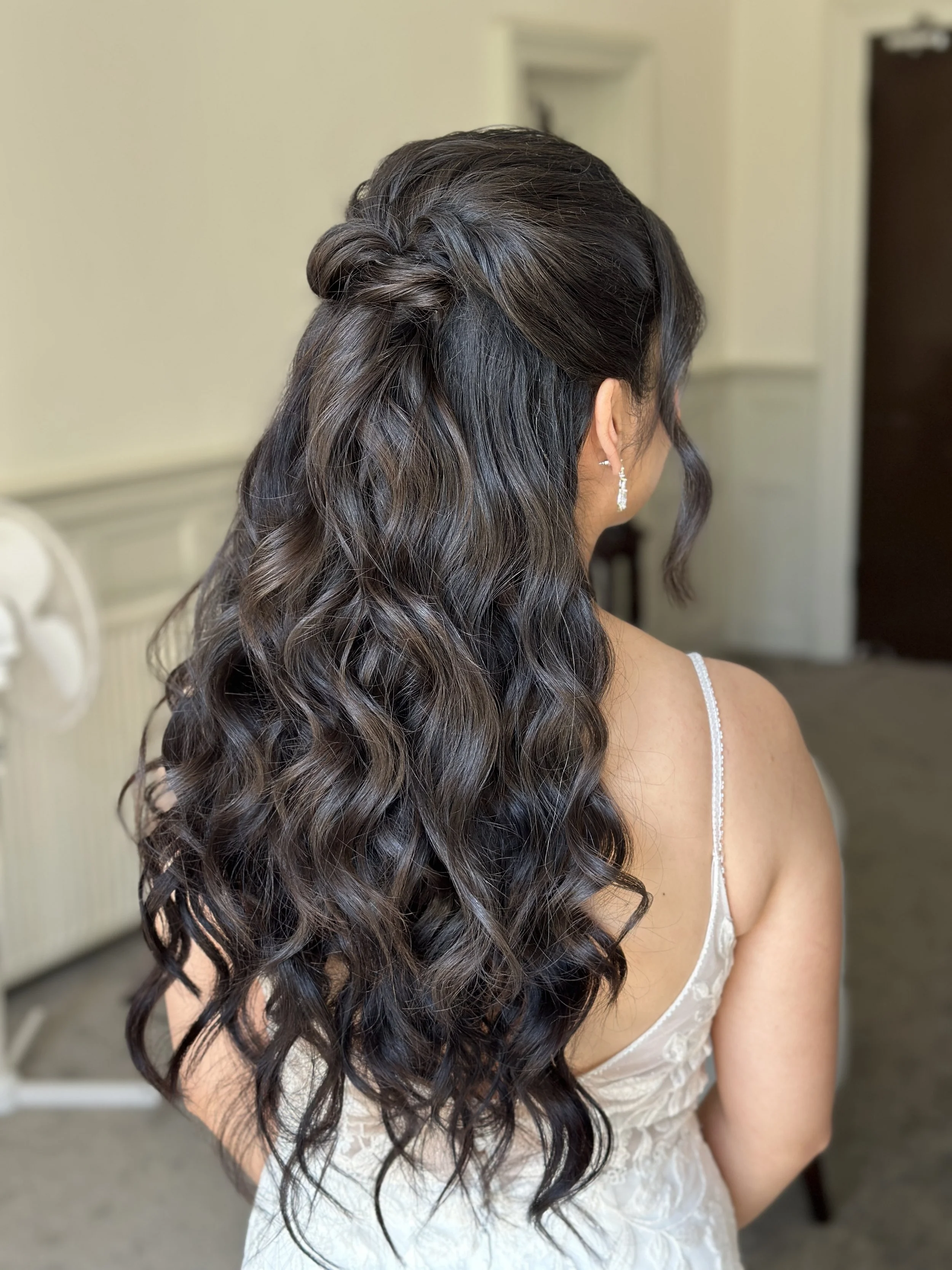 Boho half-up wedding hairstyle on dark hair
