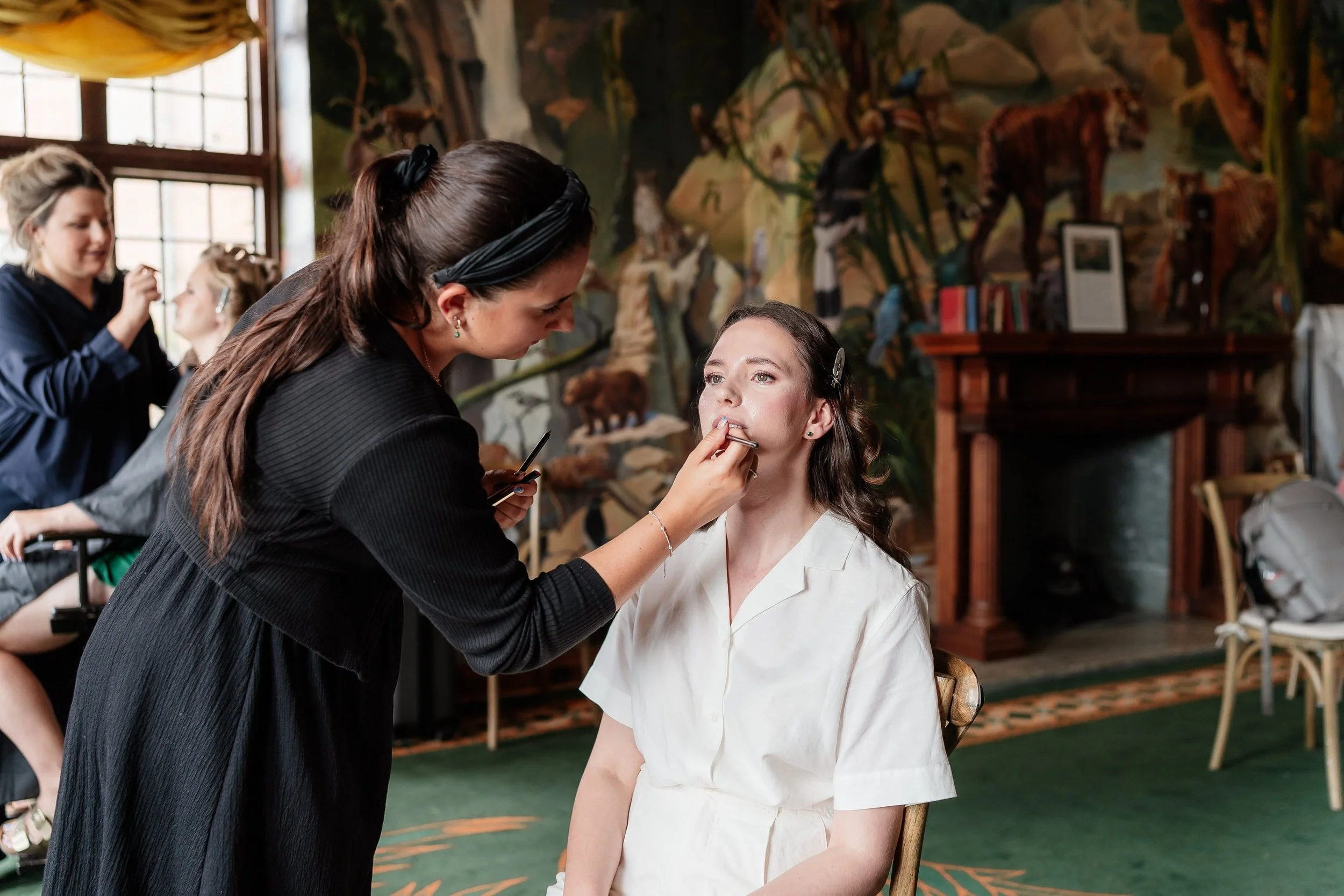 Makeup Artist applying natural bridal makeup in London