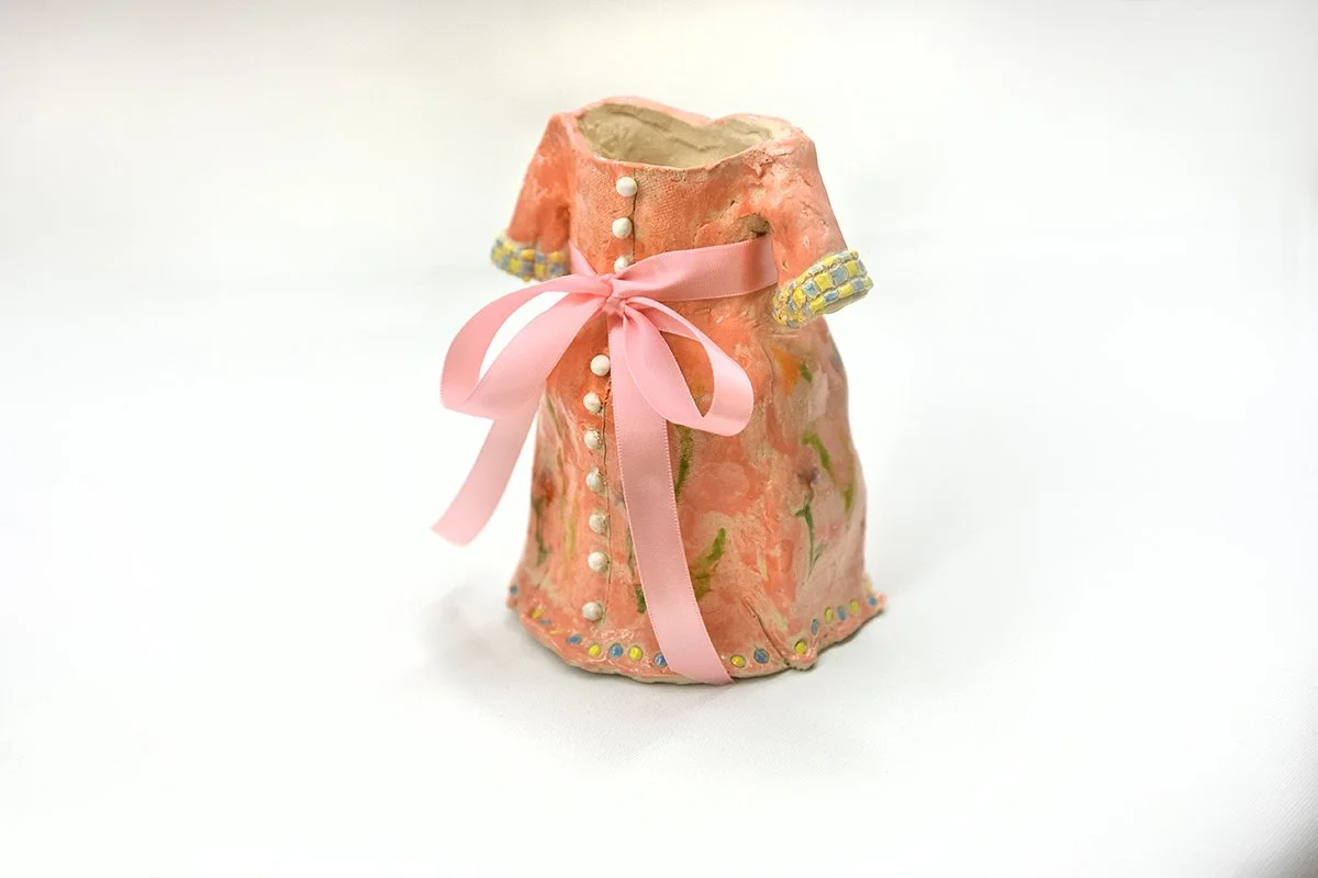 Party Dress | 
5”L x 5”D x 6.5"H |
White Stoneware with Glaze and silk ribbon | 2025