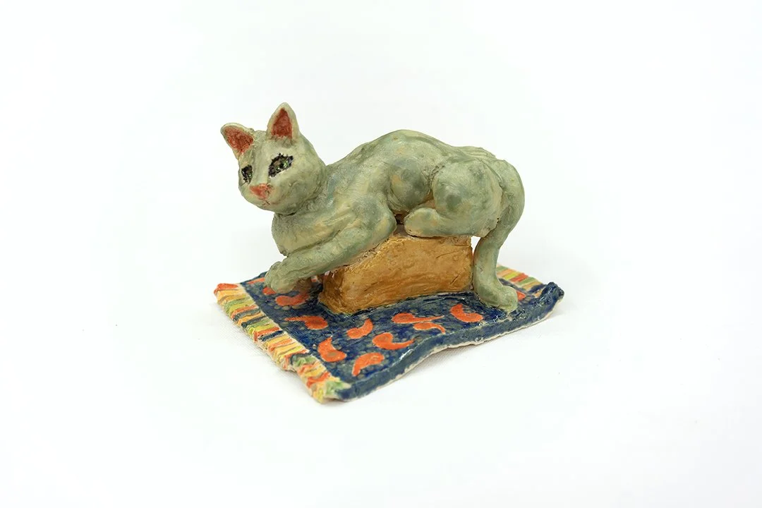 Cat on a Box on a  Rug | Side View |
5”H x 4.5"W x 6”D |
White Stoneware with Glaze | 2026