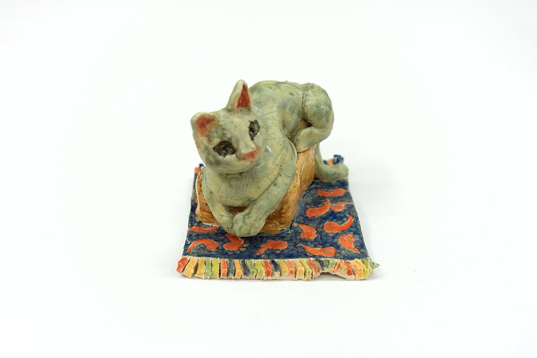 Cat on a Box on a  Rug | Head on |
5”H x 4.5"W x 6”D |
White Stoneware with Glaze | 2026
