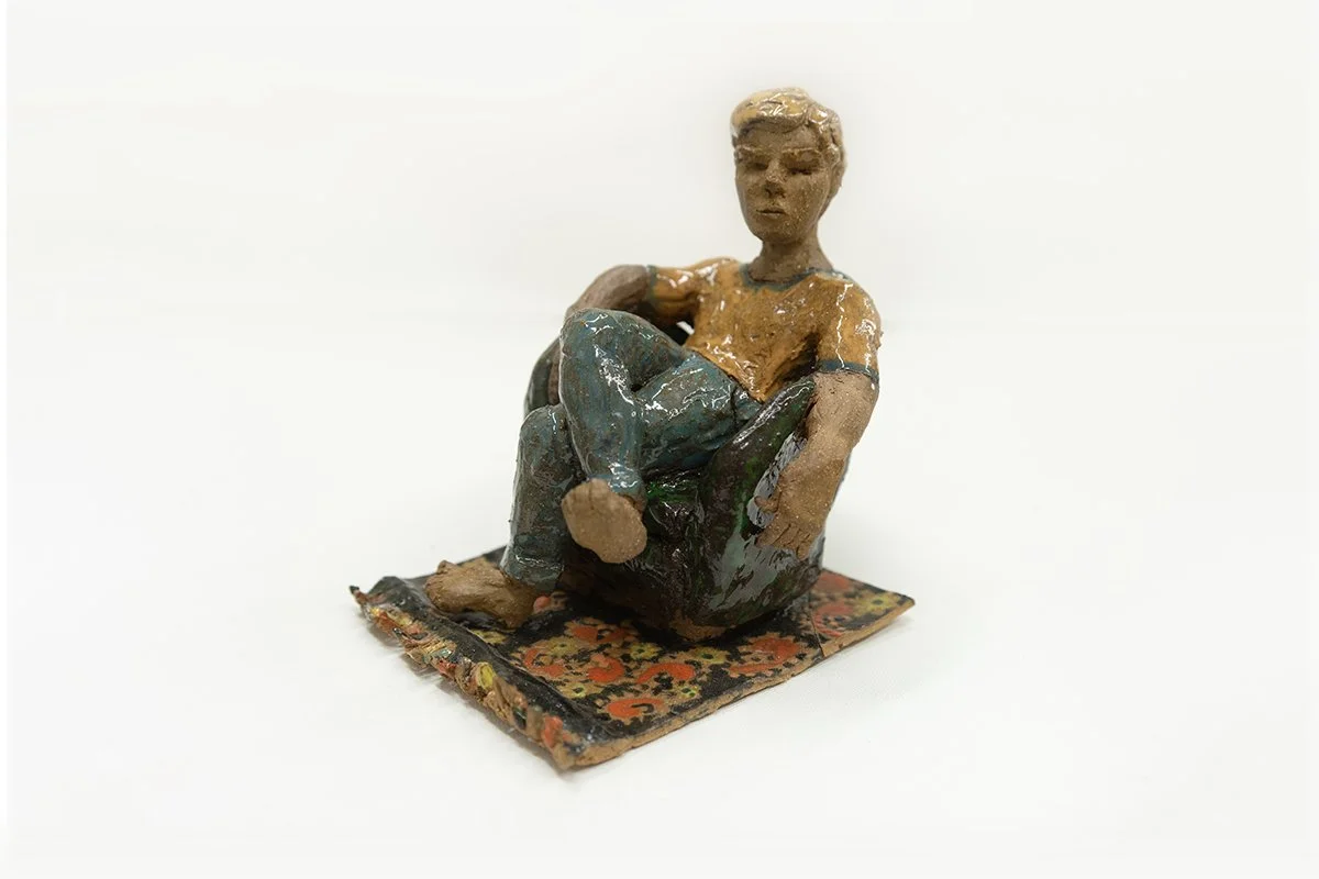 Hanging out in Armchair with Rug | 
6”H x 4.5"W x 5.25”D |
Brown Stoneware with Glaze | 2026