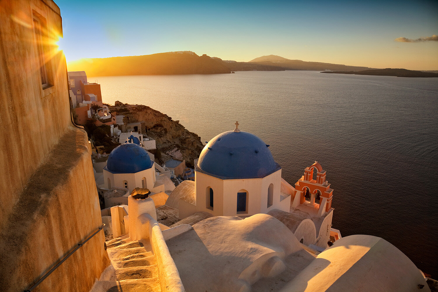  Sunrise over caldera in Oia, Santorini, Greece. 